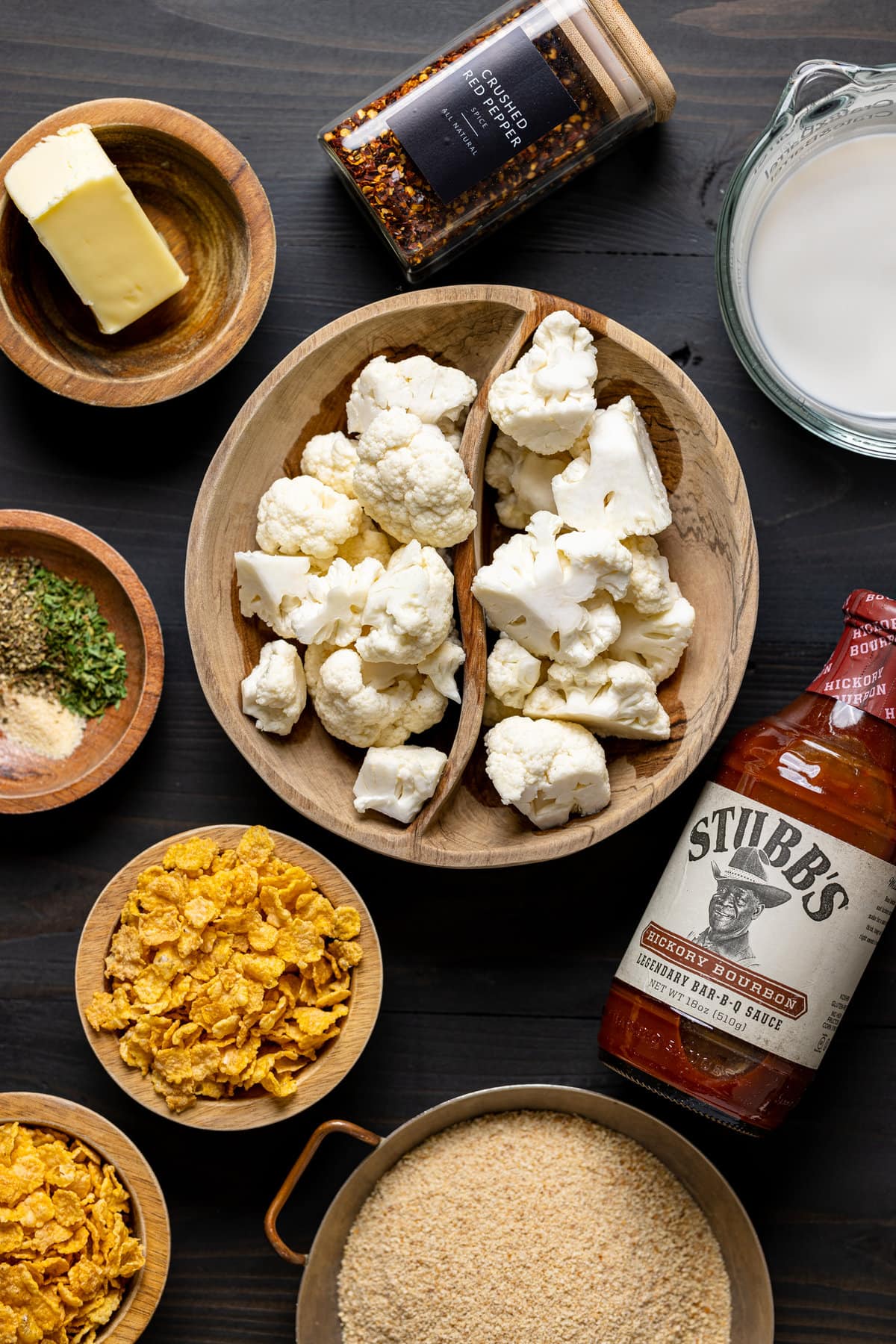 Ingredients for Crispy Buffalo Cauliflower Wings including Stubb\'s hickory bourbon barbeque sauce, corn flakes, and crushed red pepper