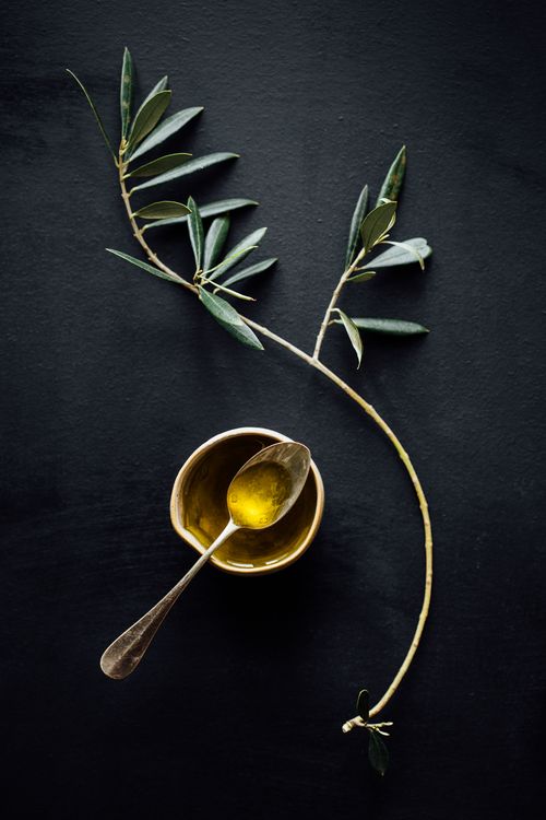 Spoon in a small bowl of olive oil.