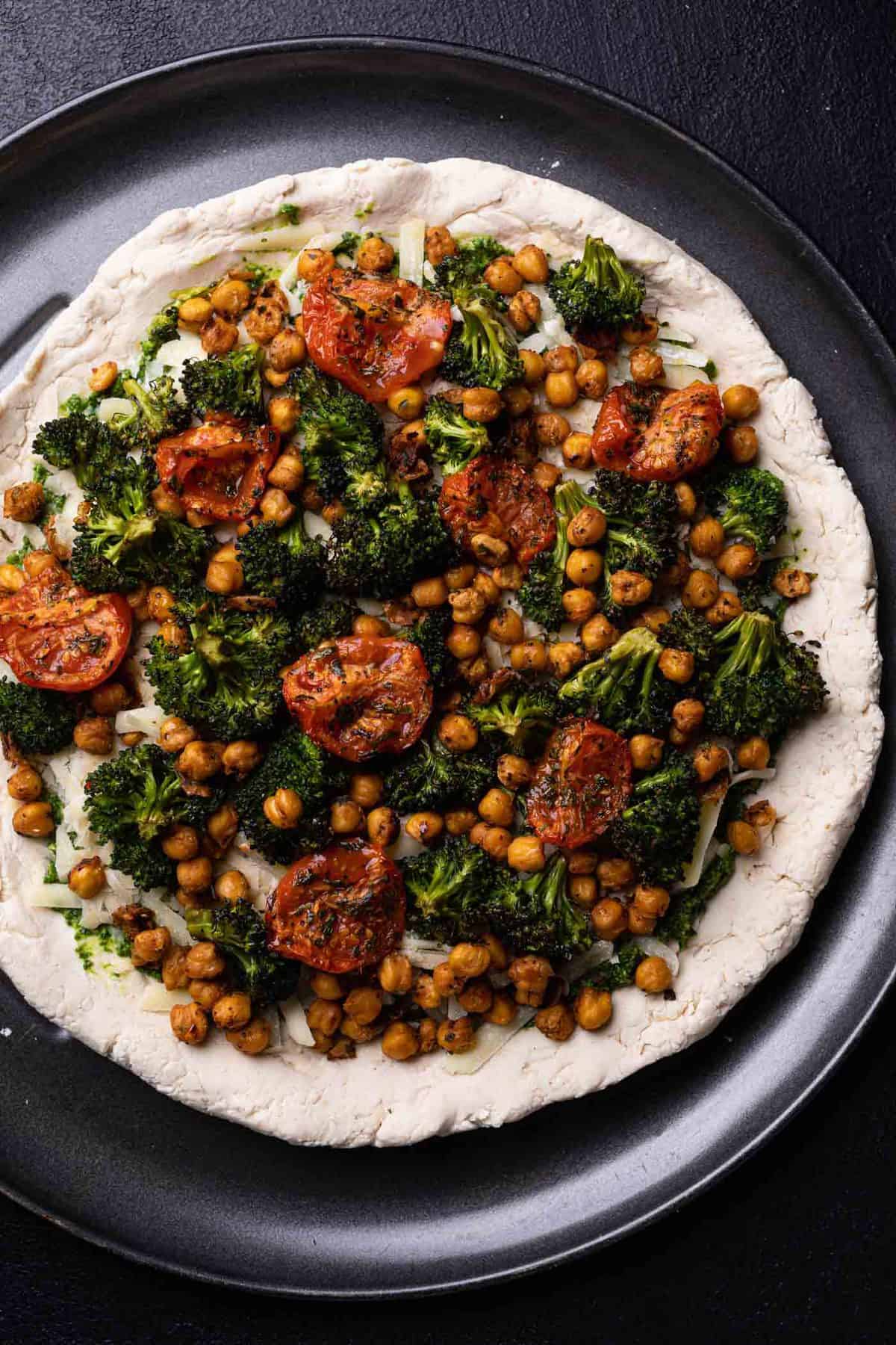 Uncooked Chickpea and Veggie Gluten-Free Pesto Pizza.