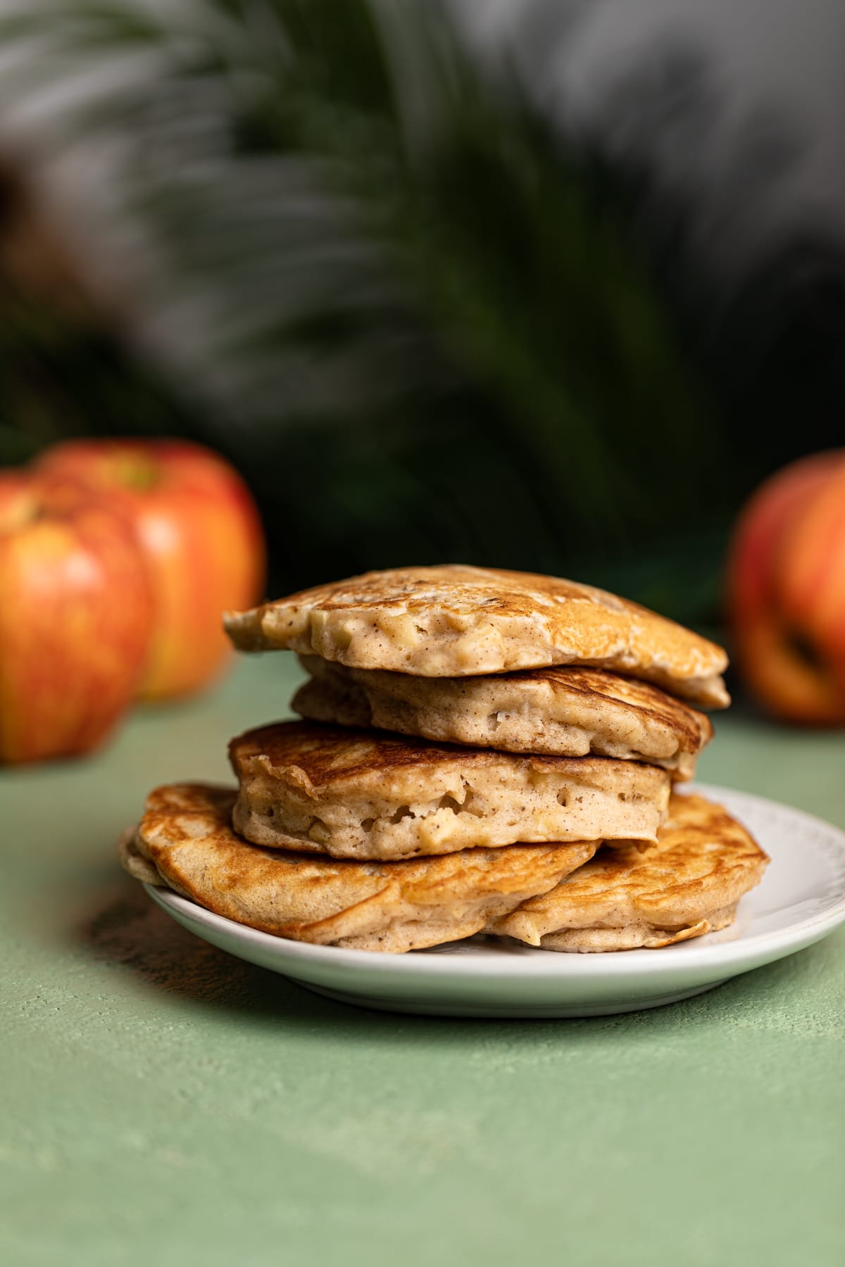 Stack of Vegan Apple Cinnamon Pancakes on a small plate