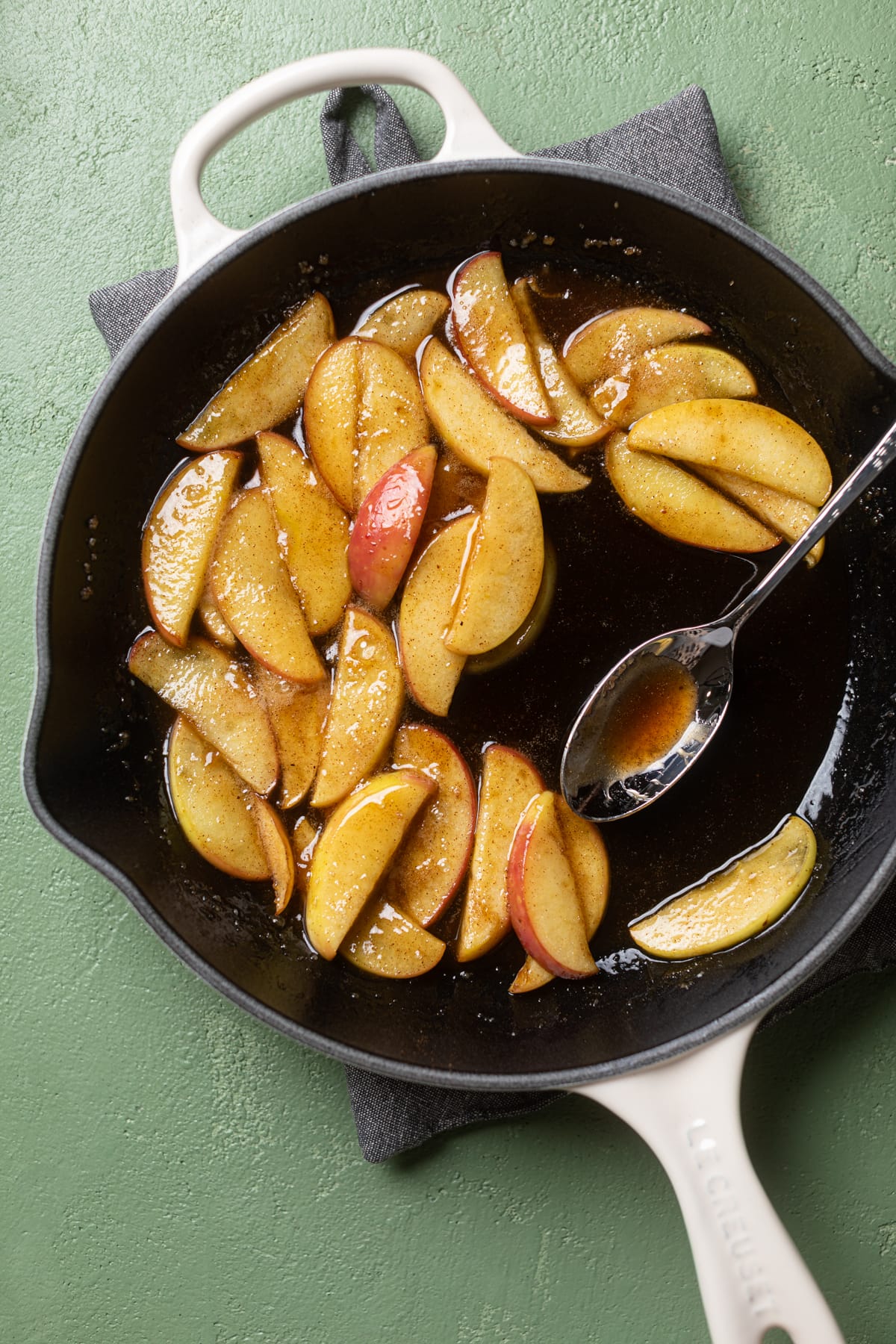 Caramelized apple slices in a skillet