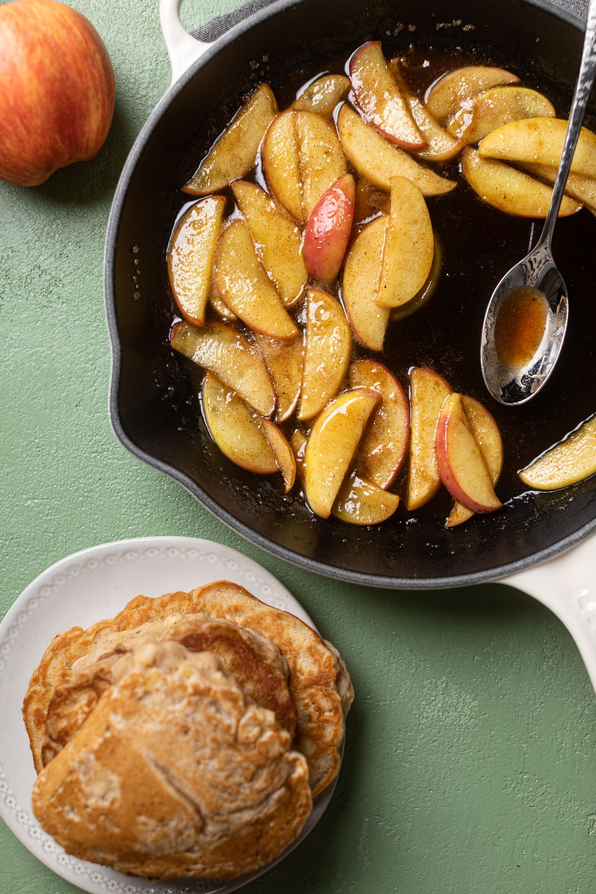 Caramelized apple slices in a skillet
