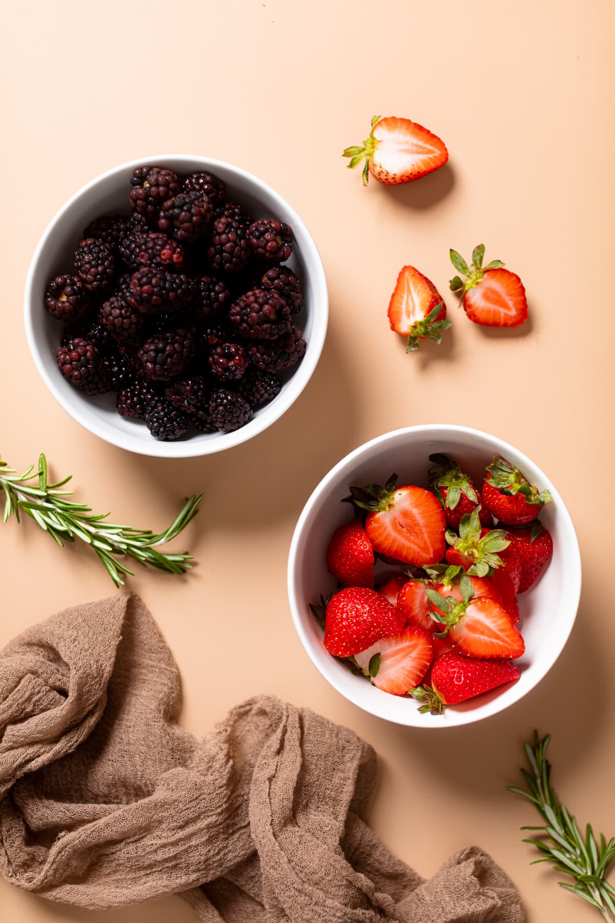 Bowls of blackberries and strawberries.