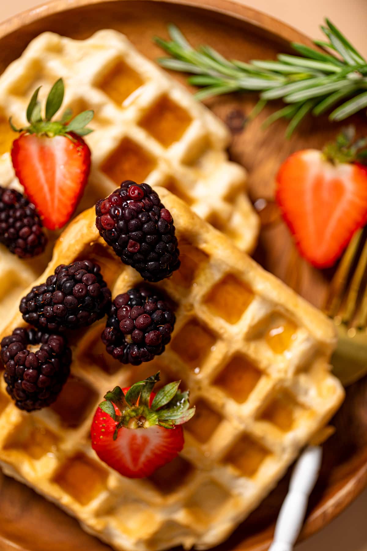 Blackberries and strawberries atop Fluffy Cinnamon Vegan Belgian Waffles.