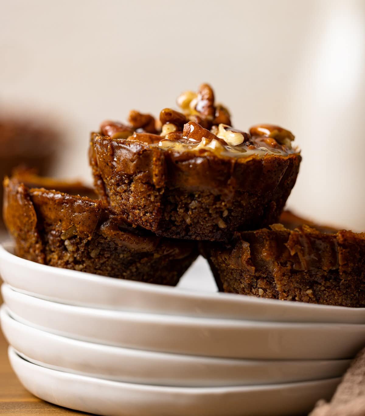 Three Mini Sweet Potato Pecan Pies on small plates.