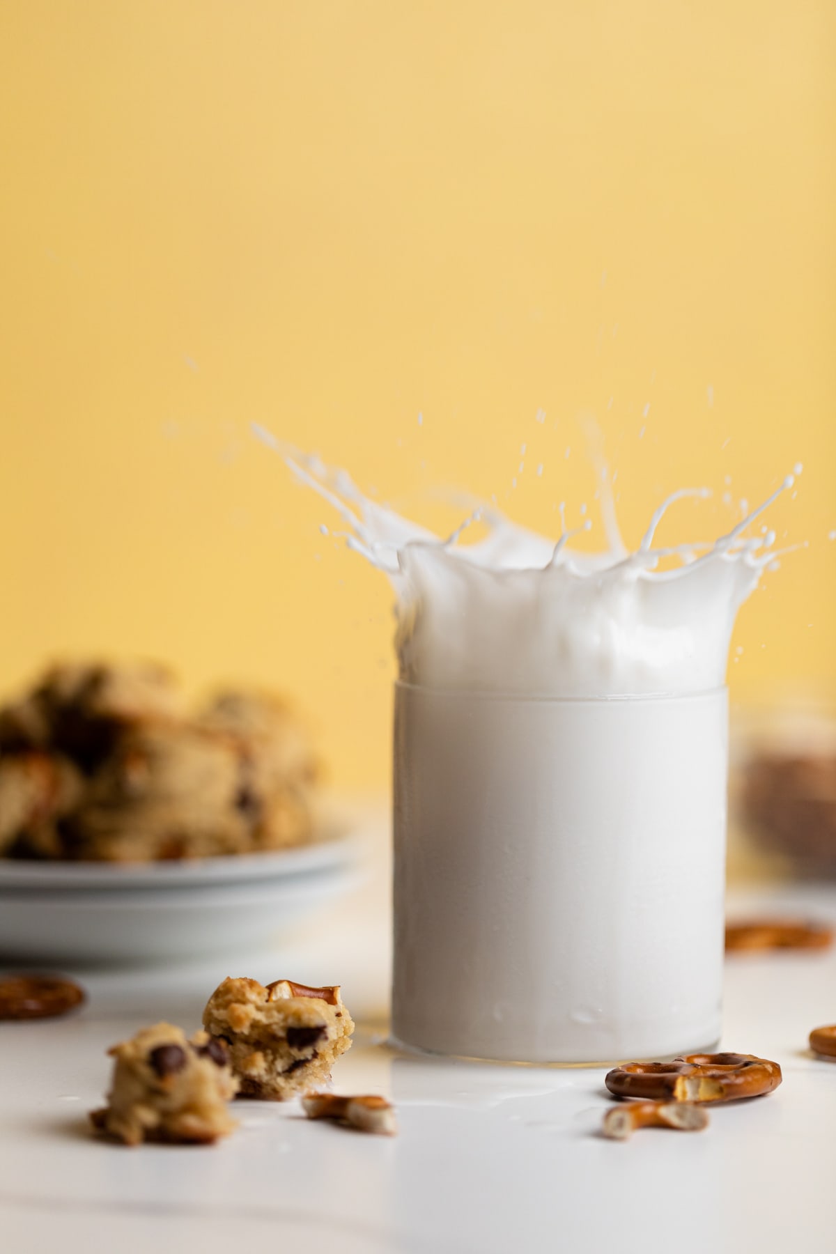 Milk splashing out of a glass.