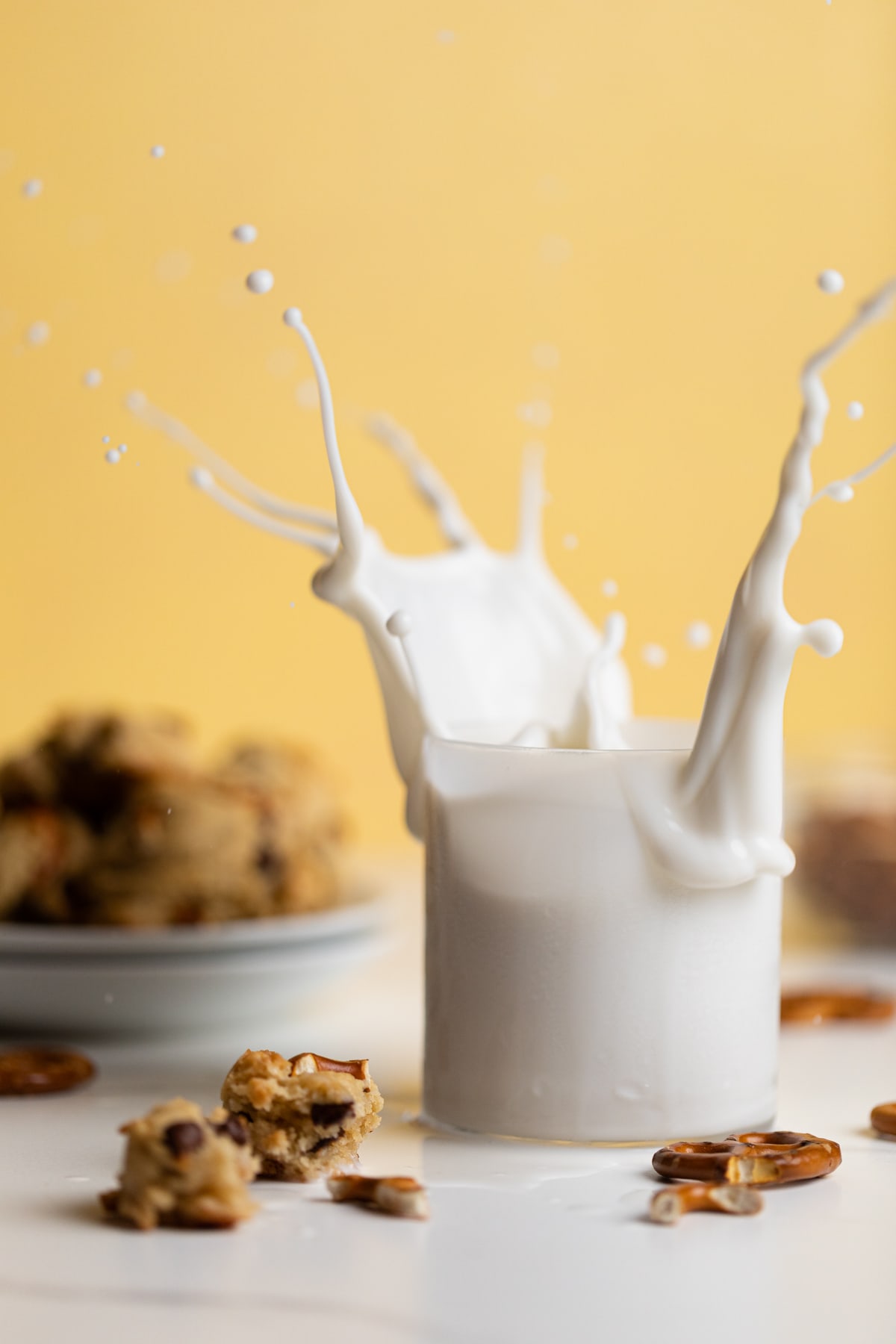 Milk splashing out of a glass.