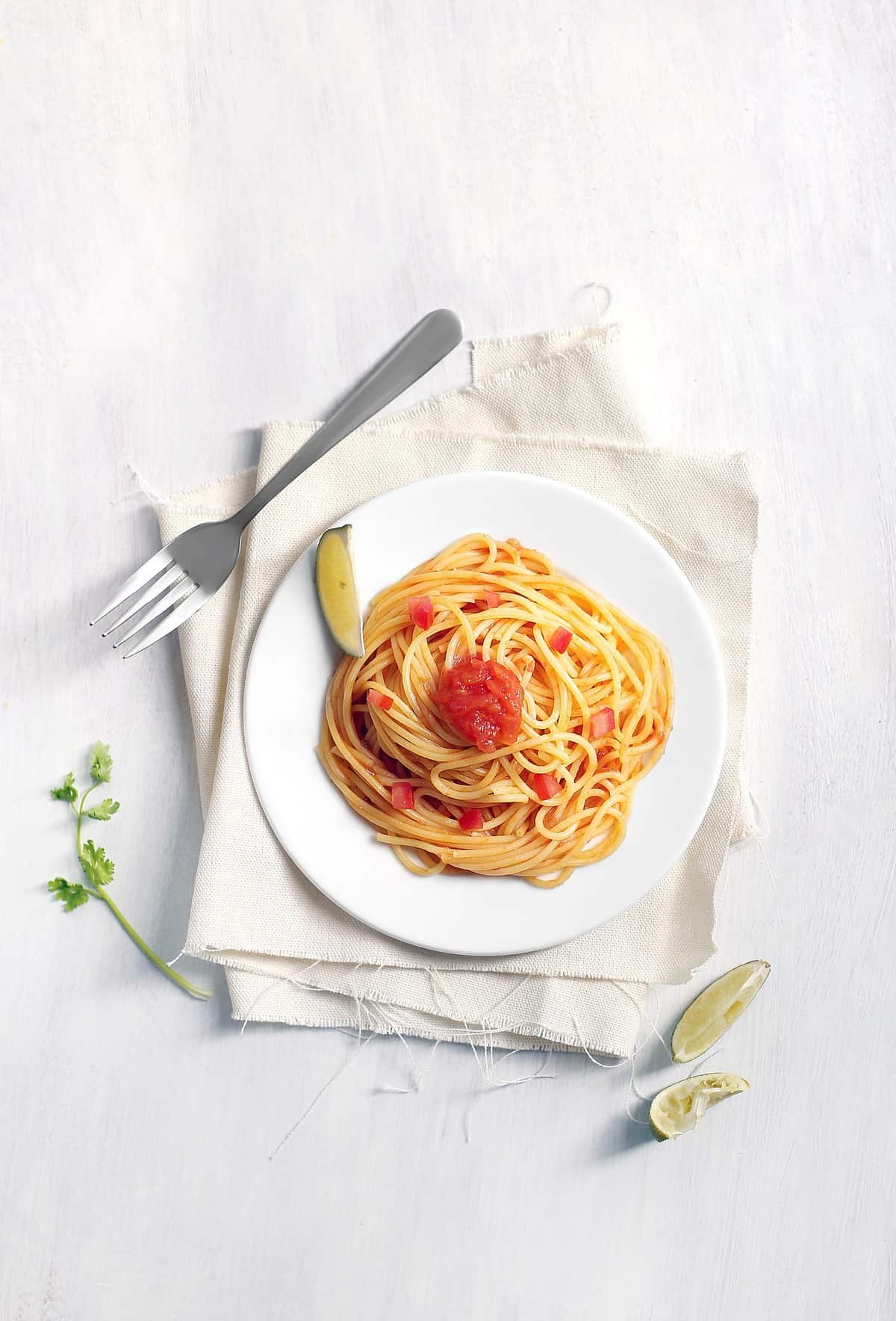 Plate of pasta with a fork.