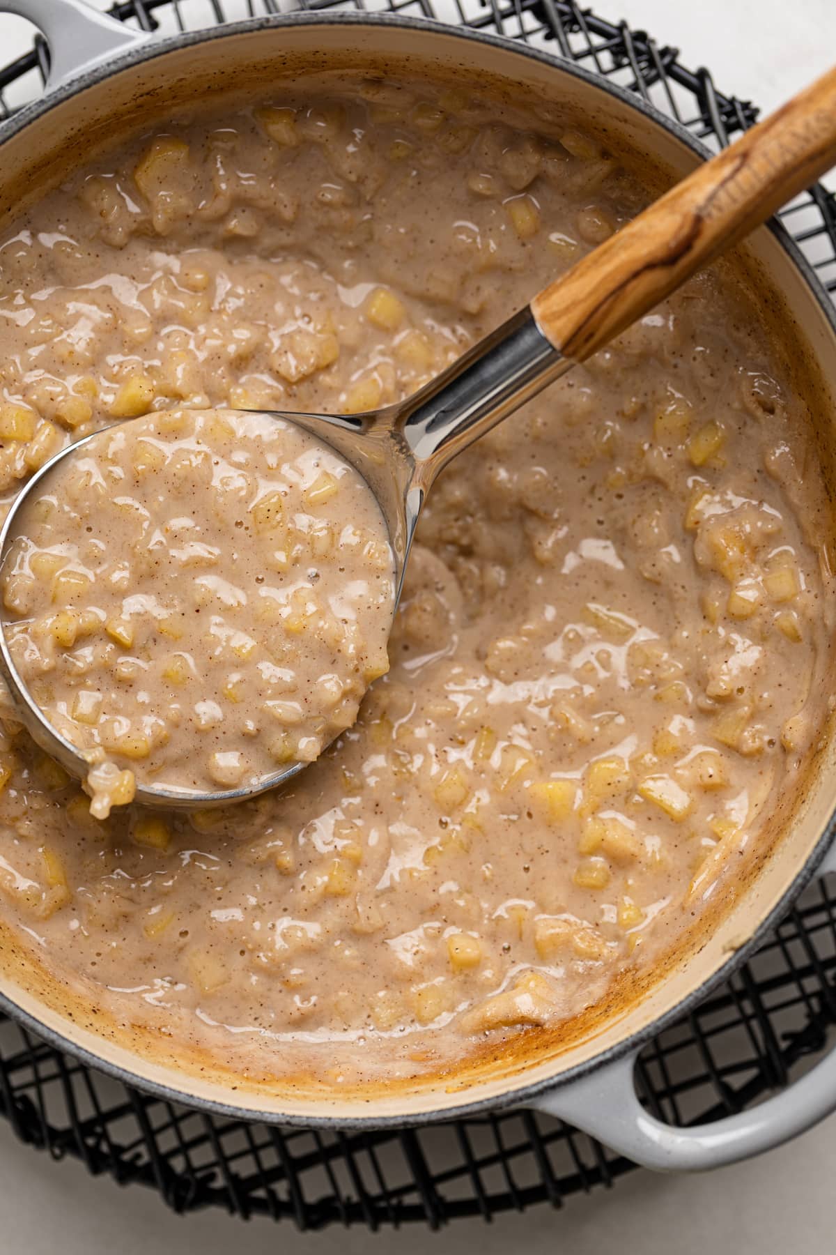 Ladle scooping some Apple Cinnamon Oatmeal Porridge 