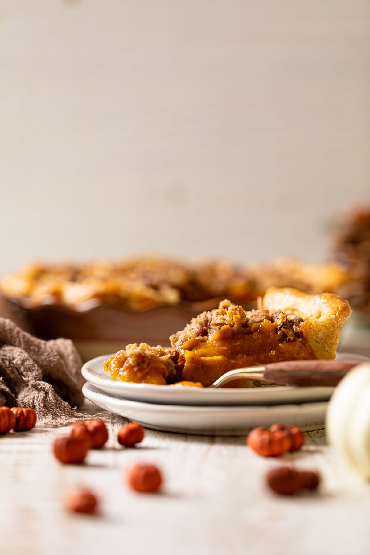 Slice of Vegan Maple Pumpkin Pie on two small, stacked plates