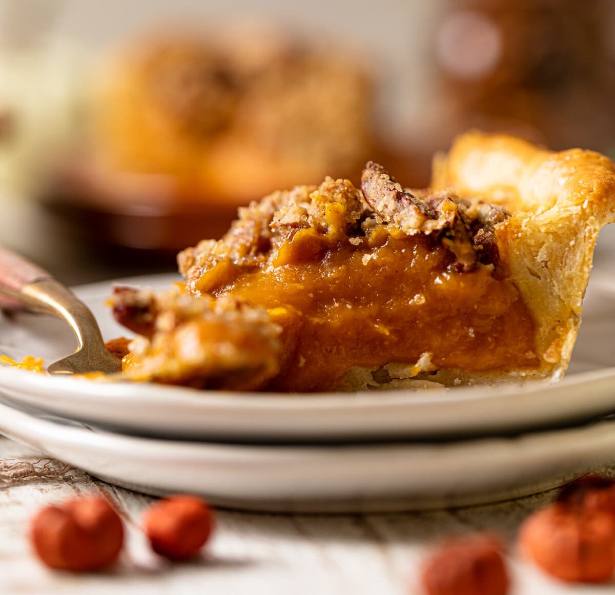 Slice of Vegan Maple Pumpkin Pie on two small, stacked plates