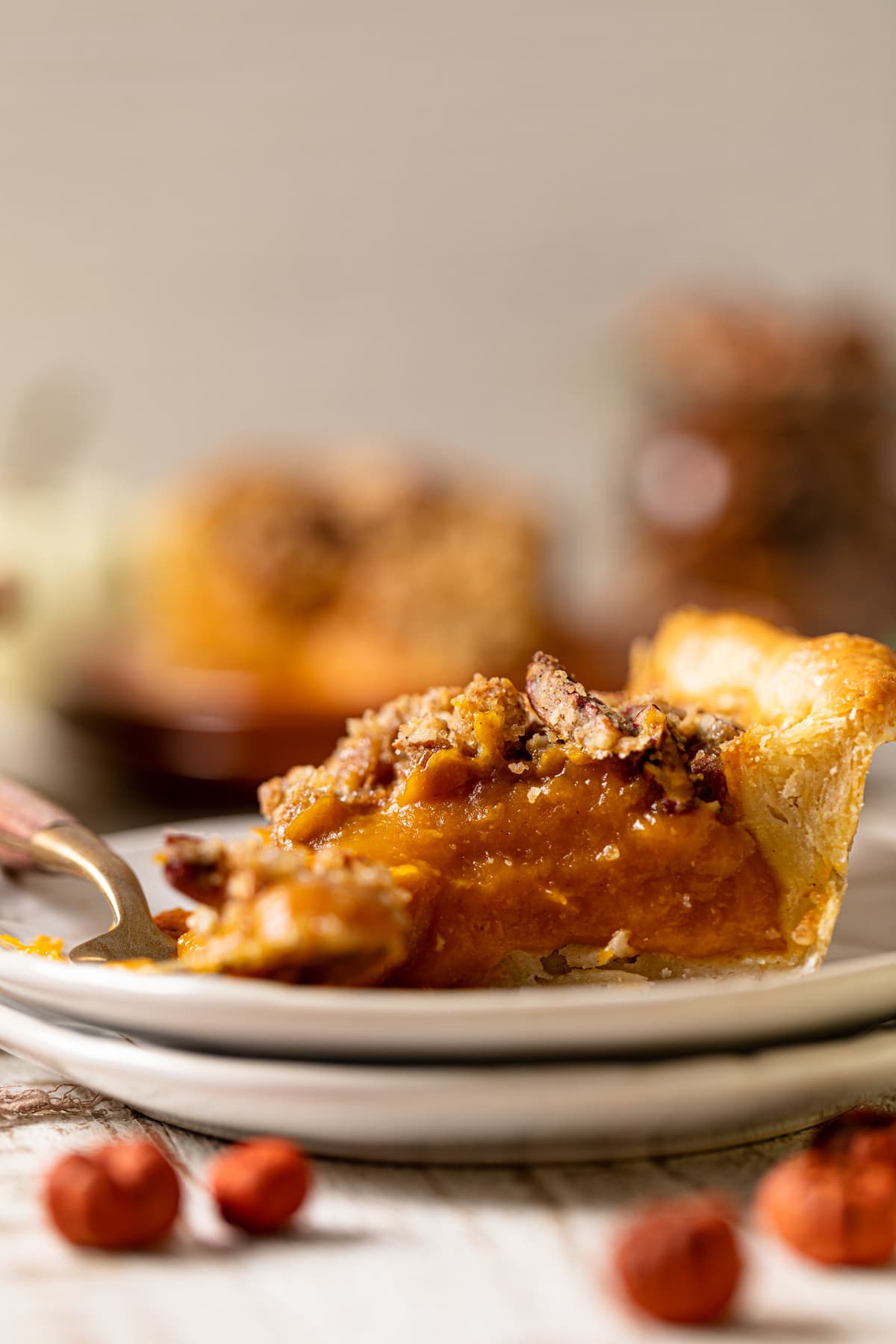 Slice of Vegan Maple Pumpkin Pie on two small, stacked plates