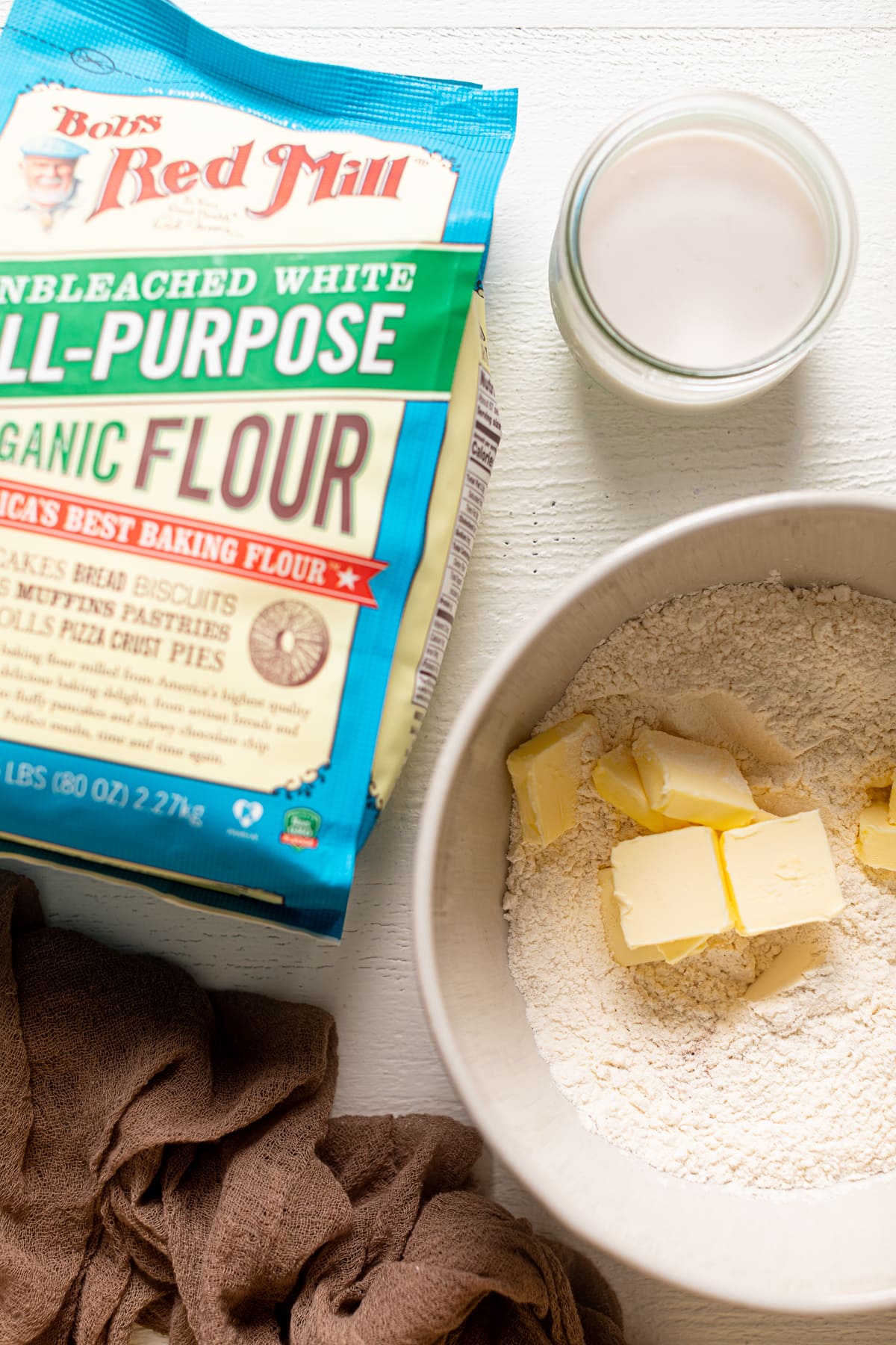 Ingredients for pie crust including organic flour, cold vegan butter, and almond butter