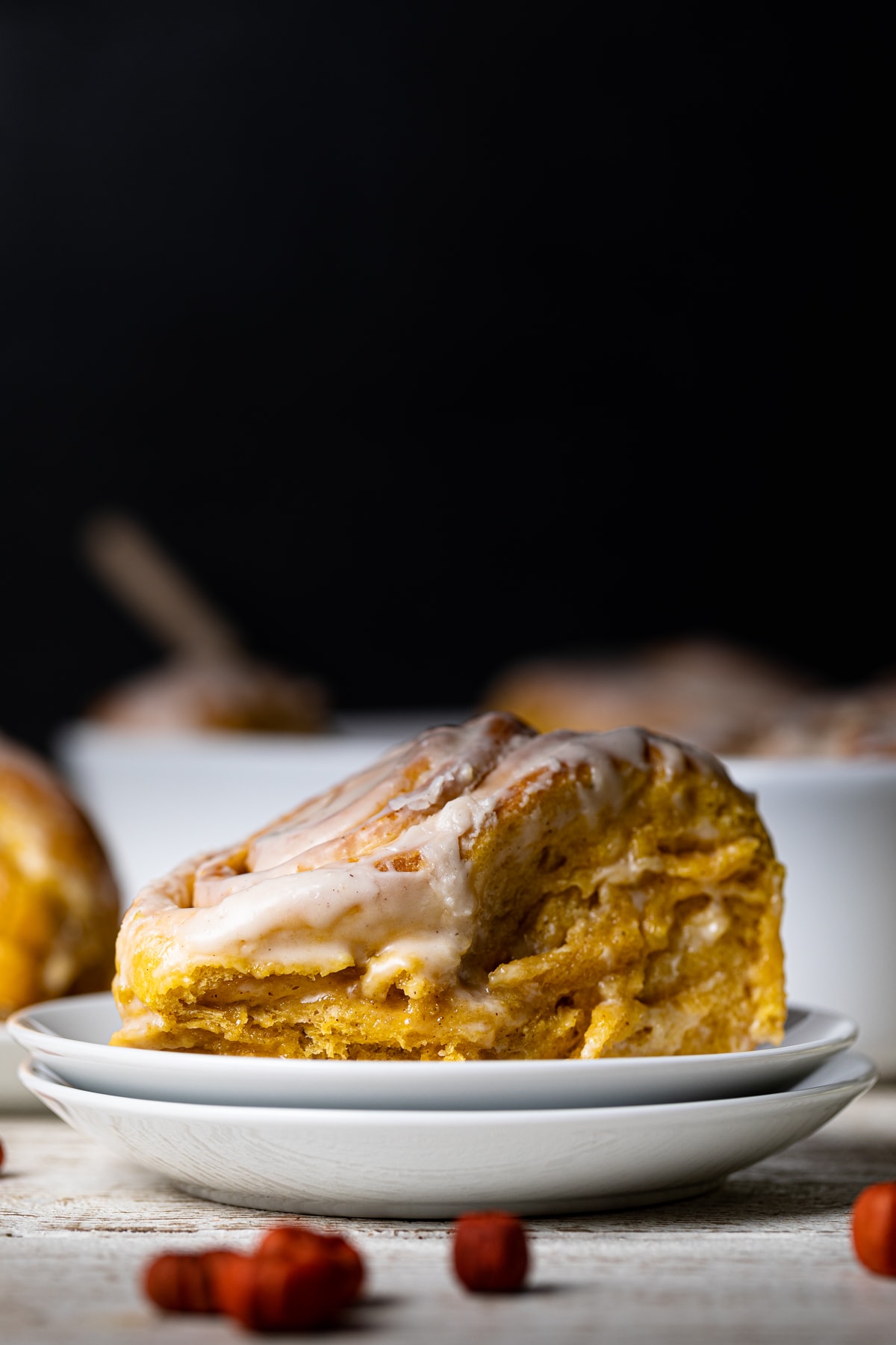 Vegan Pumpkin Cinnamon Roll on a plate.