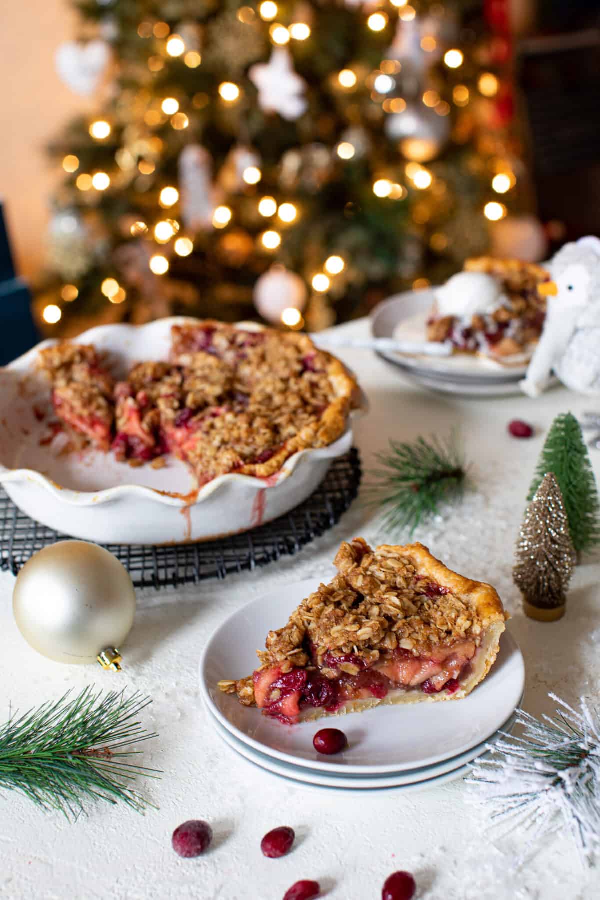 Slice of Pie on a plate in front of the rest of the pie