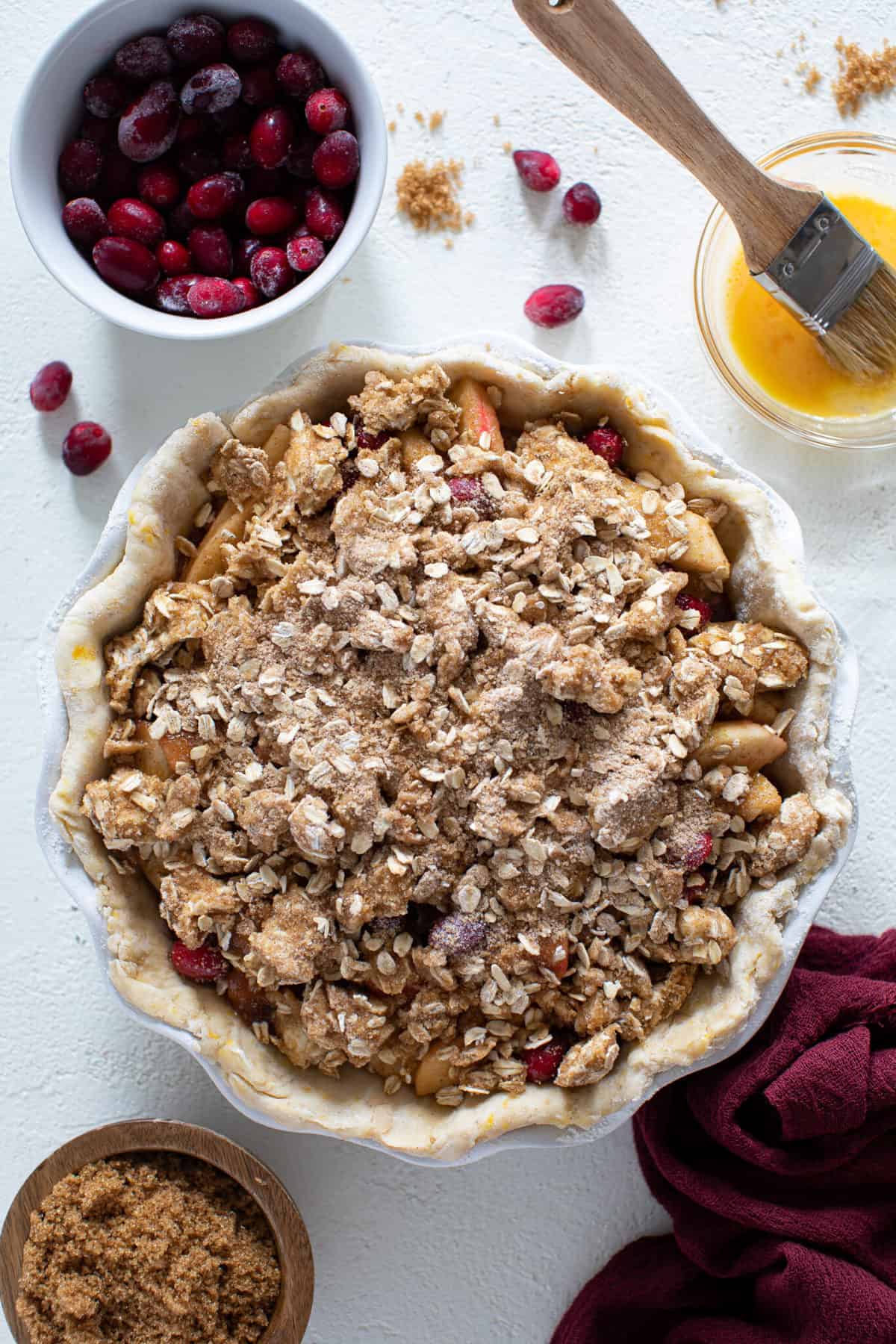 Overhead shot of uncooked Vegan Apple Cranberry Crumble Pie