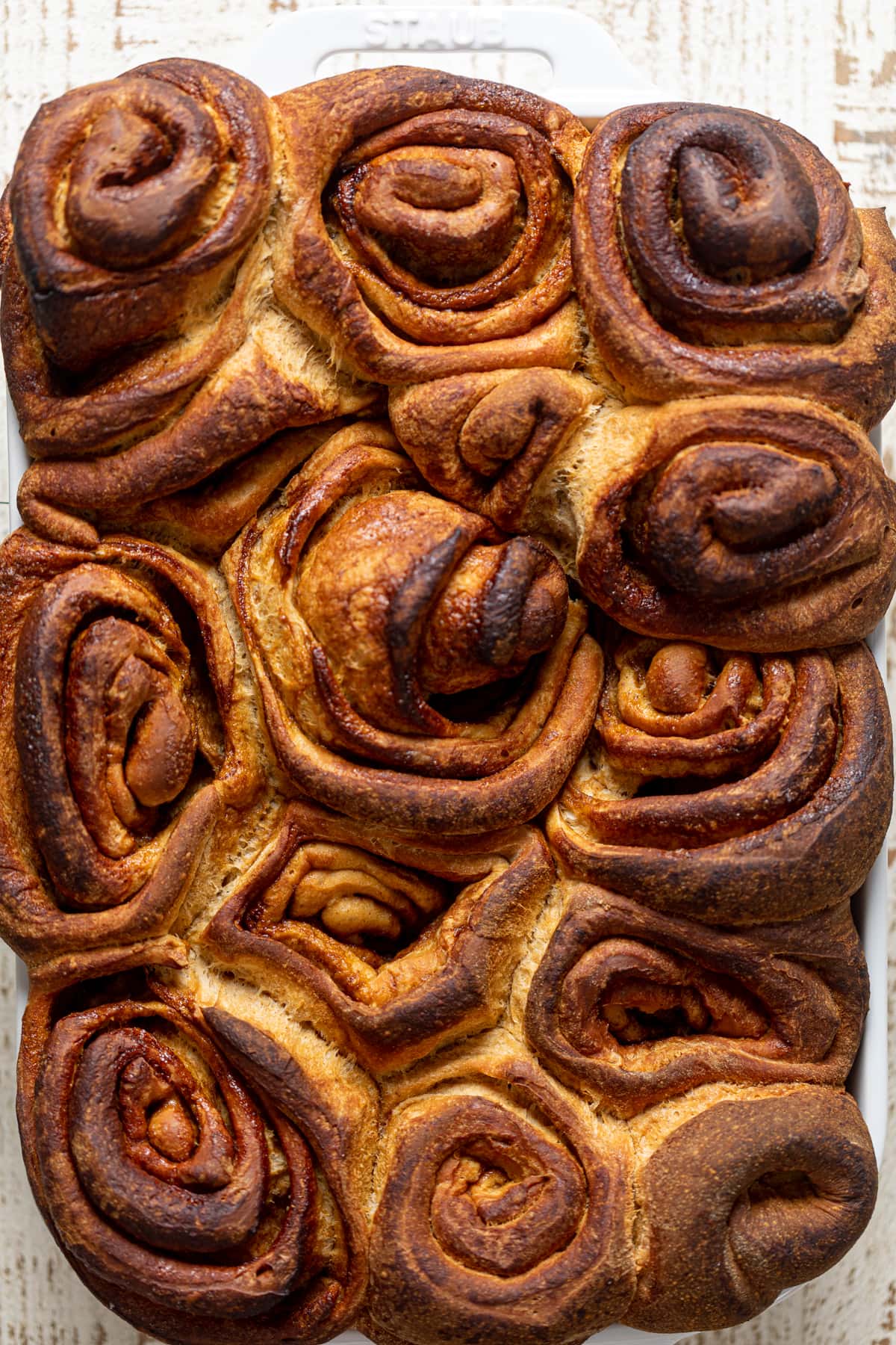 Gingerbread Cinnamon Rolls in a baking pan