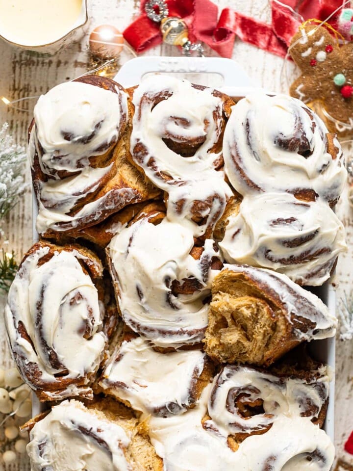 Gingerbread Cinnamon Rolls with Maple Cream Cheese Frosting in a baking dish