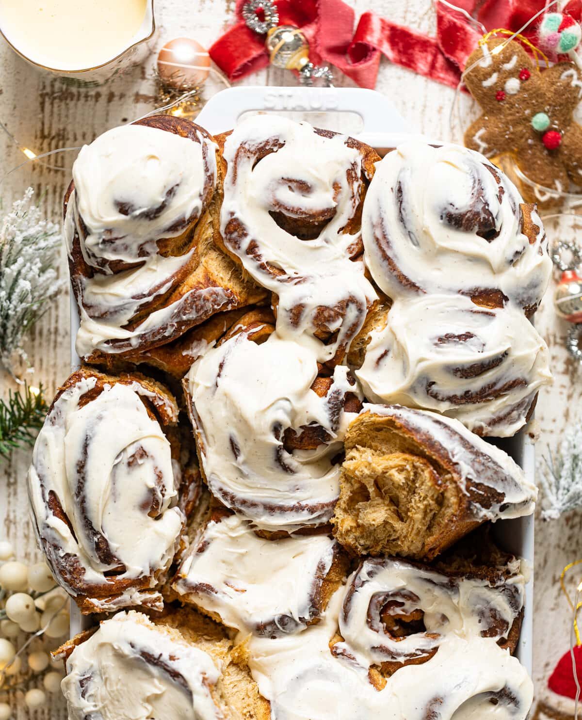 Gingerbread Cinnamon Rolls with Maple Cream Cheese Frosting in a baking dish