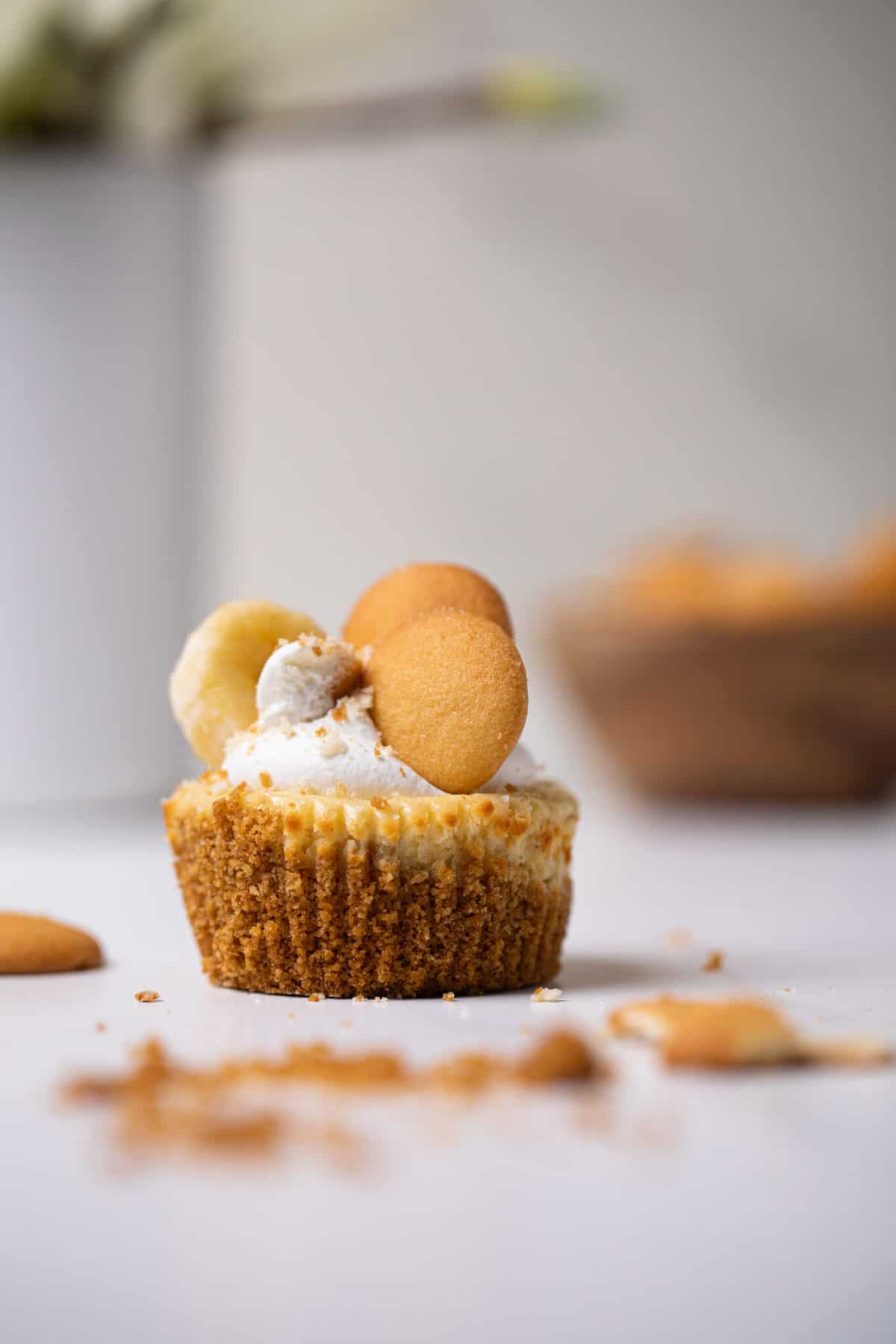 Banana Pudding Cheesecake Bite on a white counter.