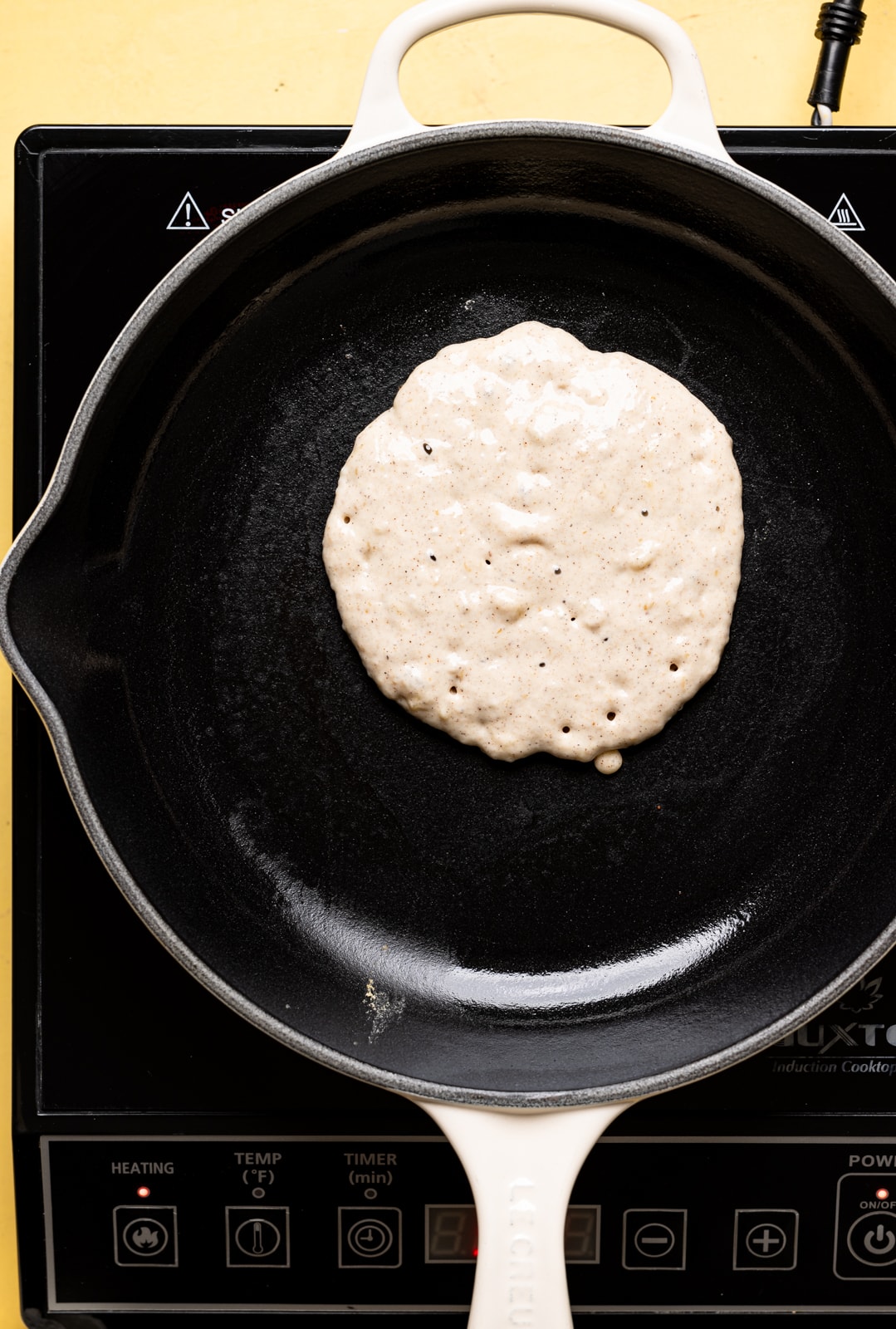 Pancake cooking in a skillet. 