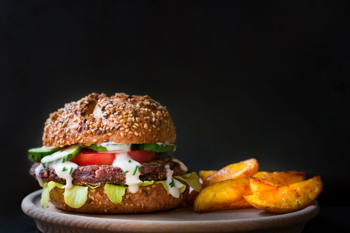 Vegan burger on a plate with fries