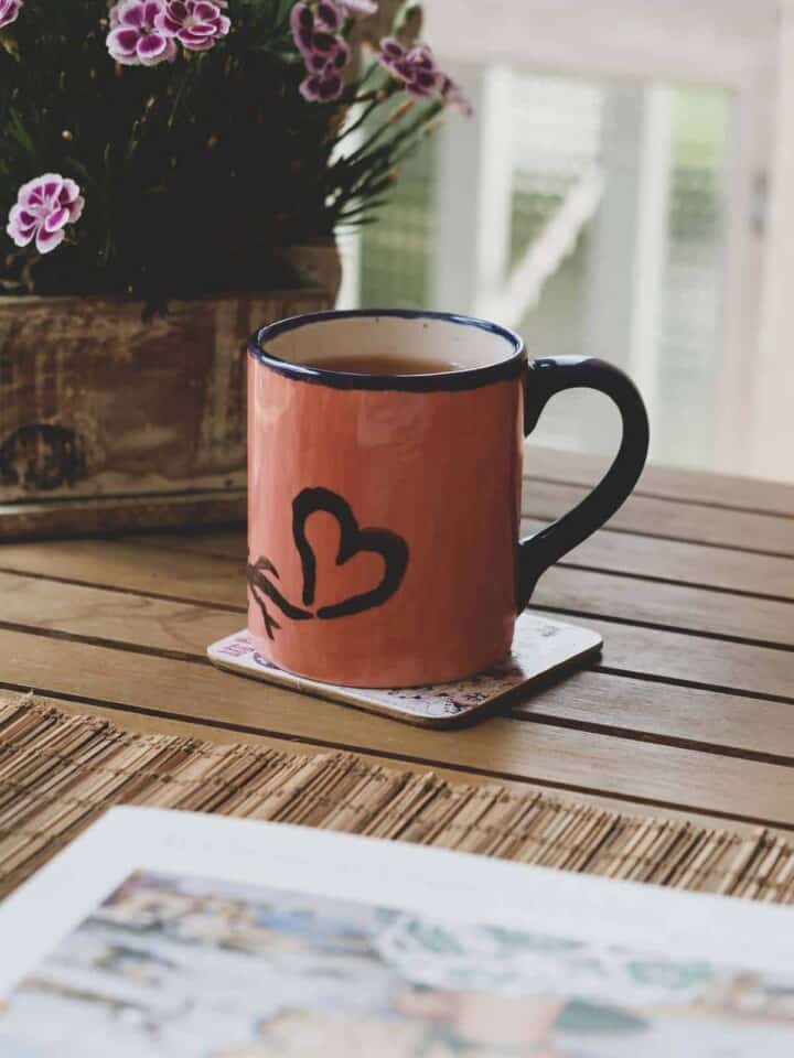 Red mug with a black heart.