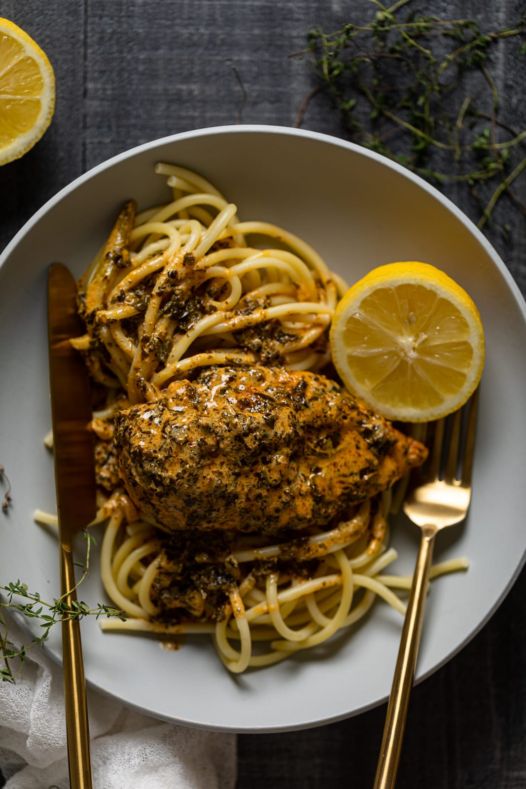 Plate of Creamy Lemon and Herb Parmesan Chicken with utensils
