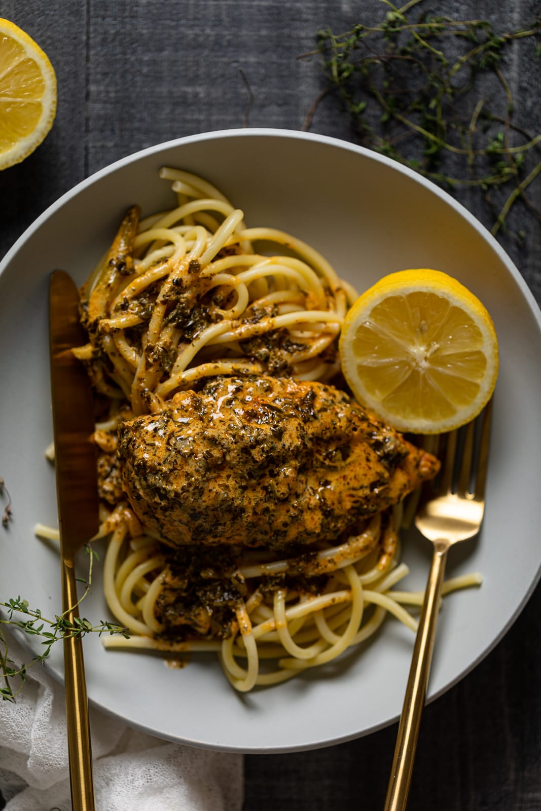Plate of Creamy Lemon and Herb Parmesan Chicken with utensils