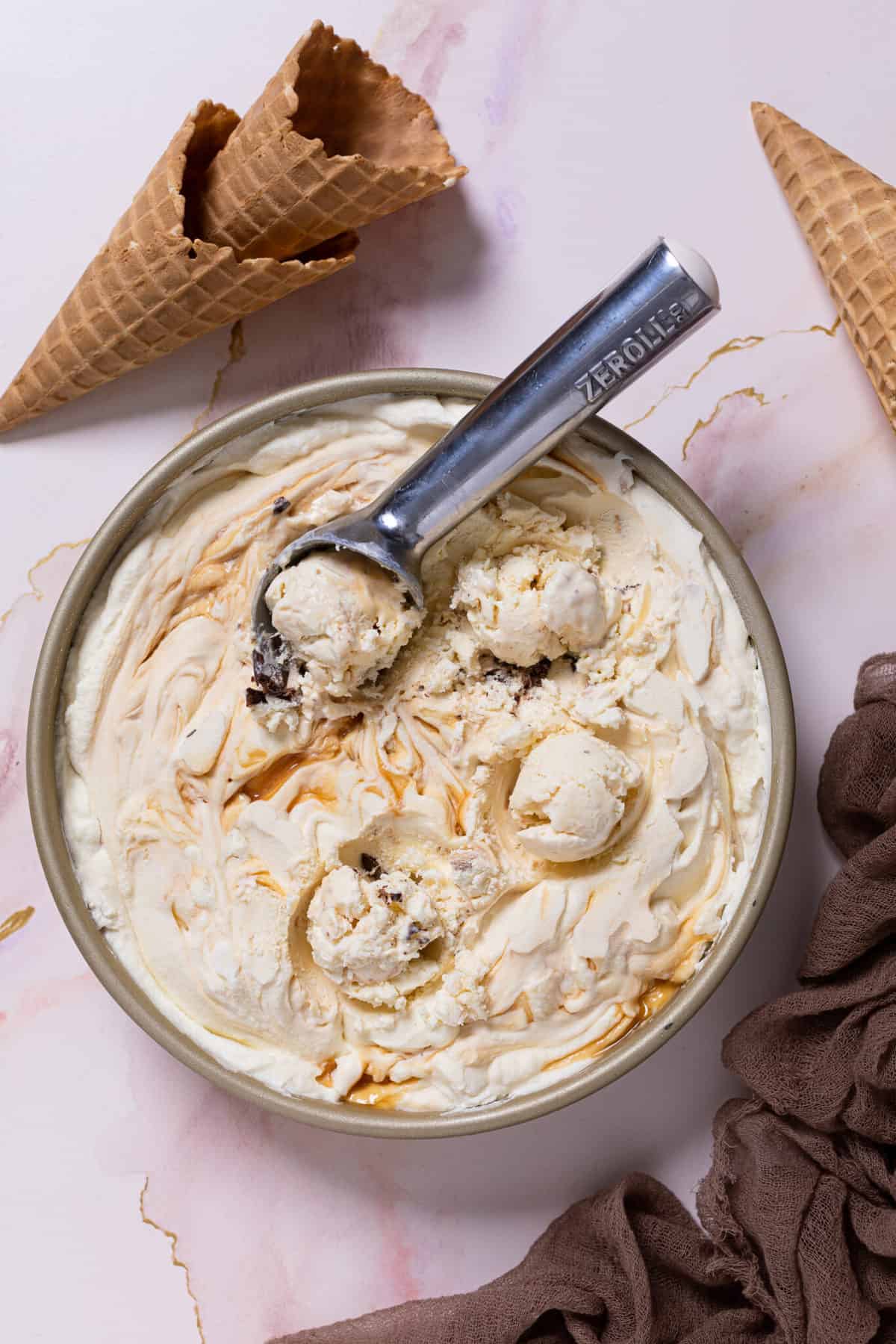 Spoon scooping No-Churn Caramel Cone Ice Cream.