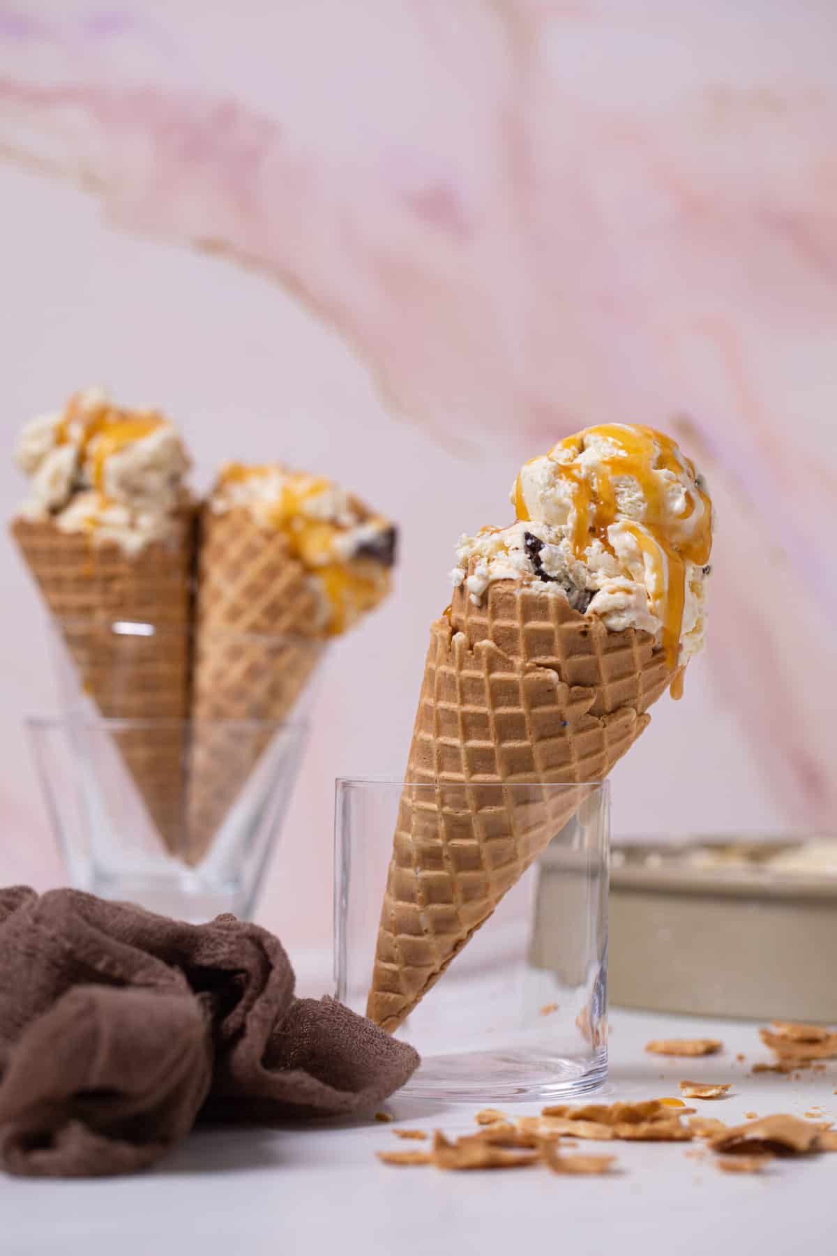 Cones of No-Churn Caramel Cone Ice Cream standing up in glasses.