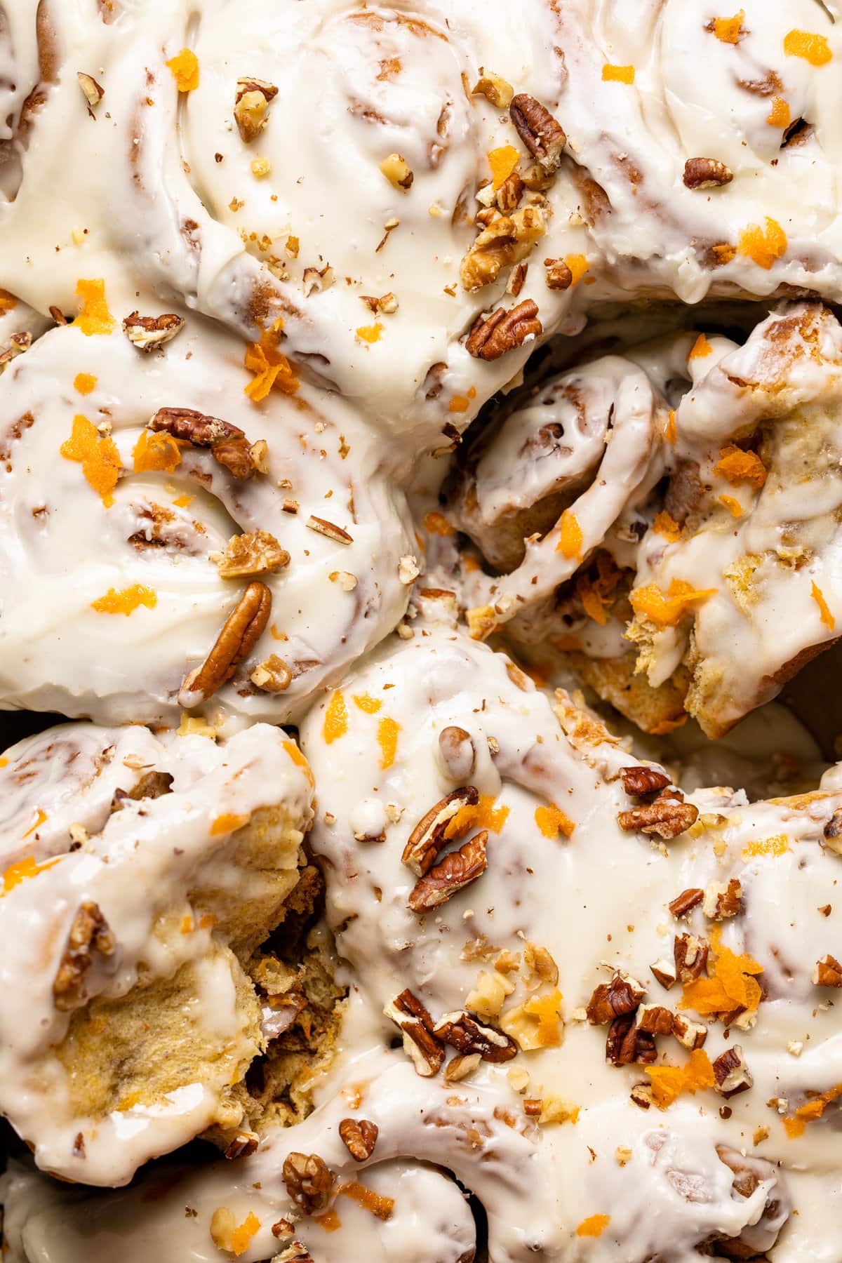 Closeup of Southern-Style Carrot Cake Cinnamon Rolls after being frosted