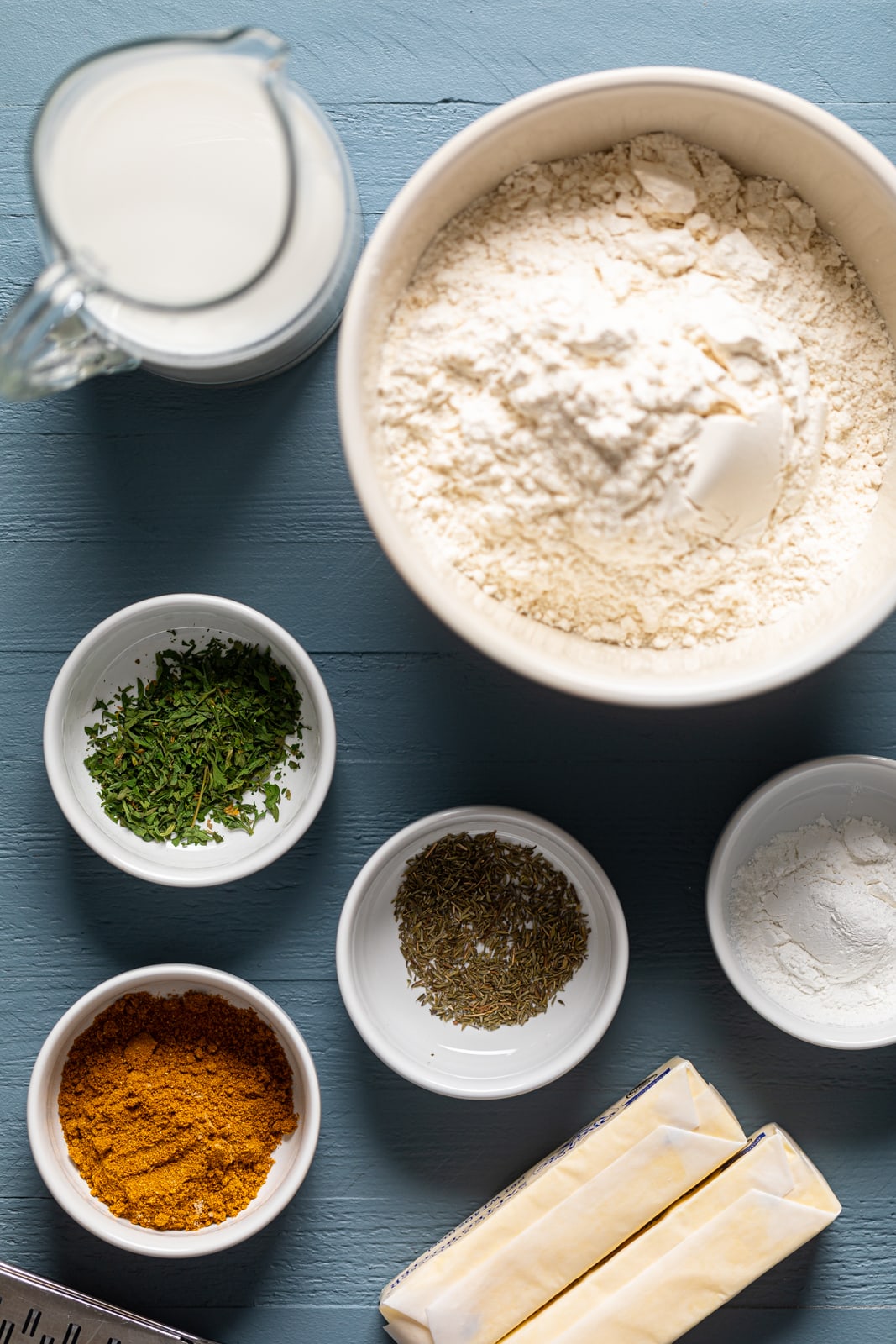 Ingredients for Spicy Jamaican Beef Patty crust including flour, turmeric, and salted butter