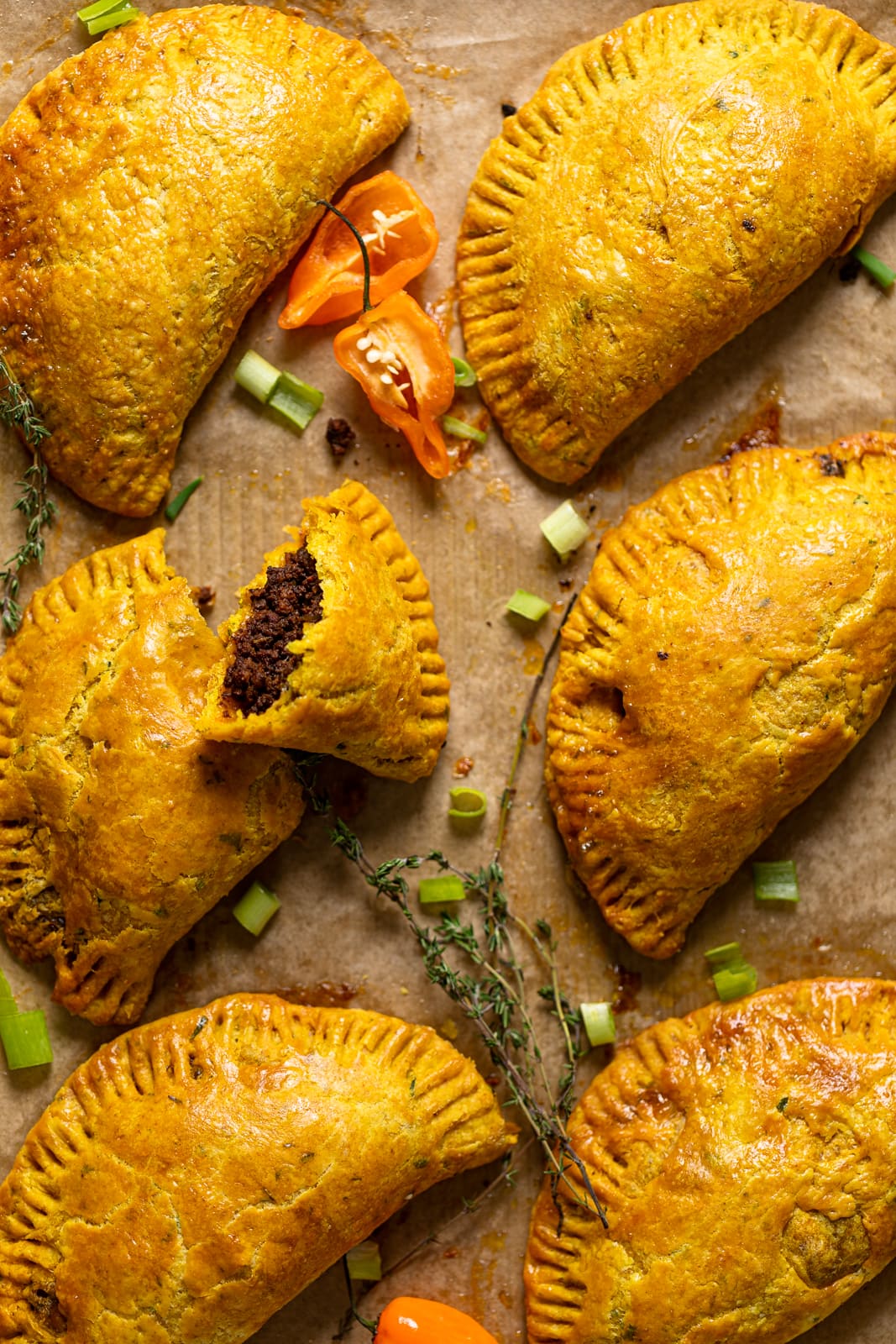 Overhead shot of Spicy Jamaican Beef Patties on parchment paper