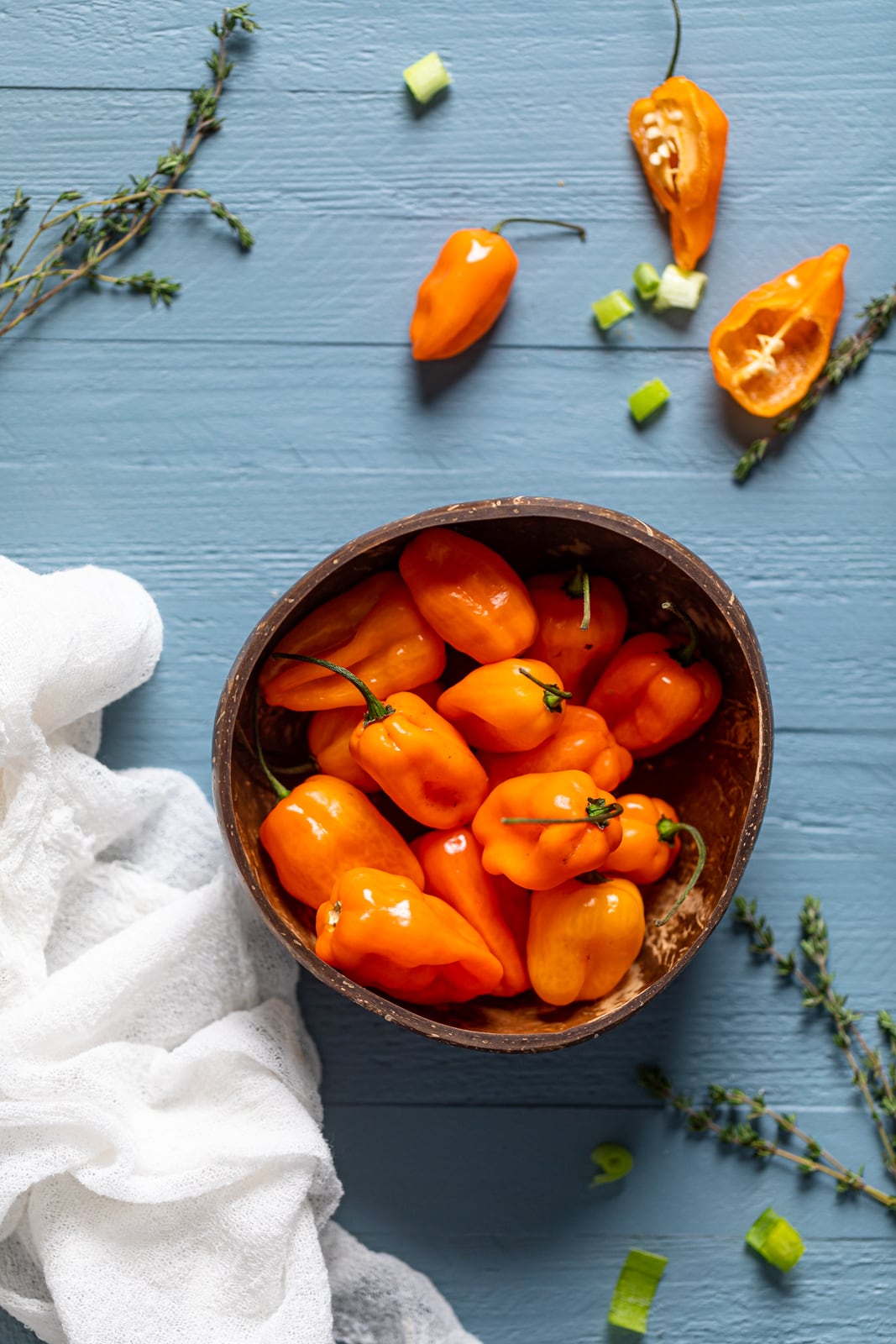 Wooden bowl of orange Scotch bonnet peppers