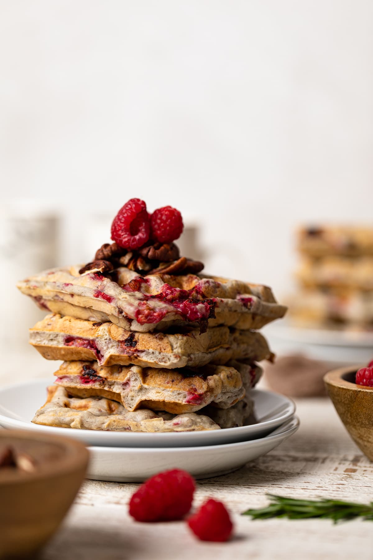 Stack of Raspberry Pecan Vegan Waffles on two small, stacked plates