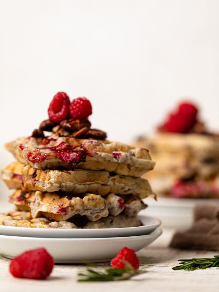 Stack of Raspberry Pecan Vegan Waffles on two small, stacked plates