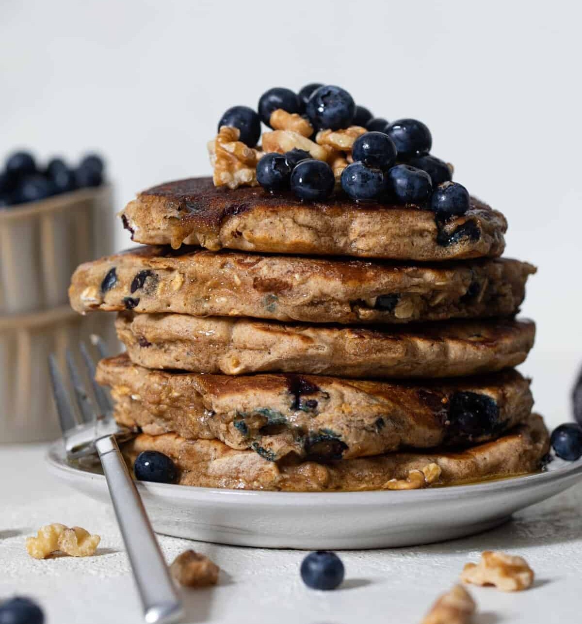 Blueberry Whole Wheat Pancakes on a plate with a fork.