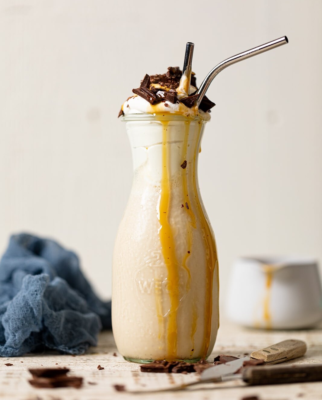 Salted Caramel Chunky Milkshake with caramel dripping down the sides