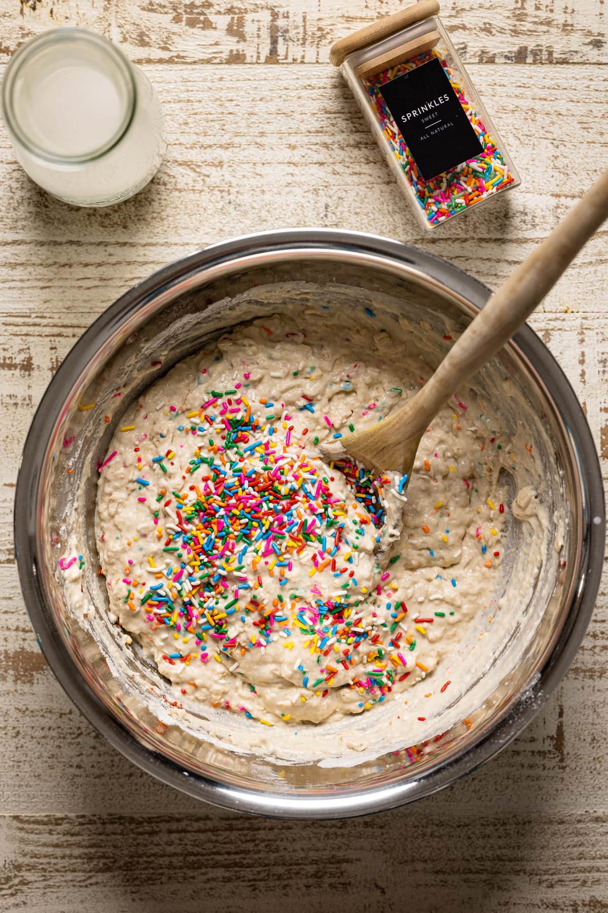 Funfetti Oatmeal Vegan Waffle batter being stirred in a bowl