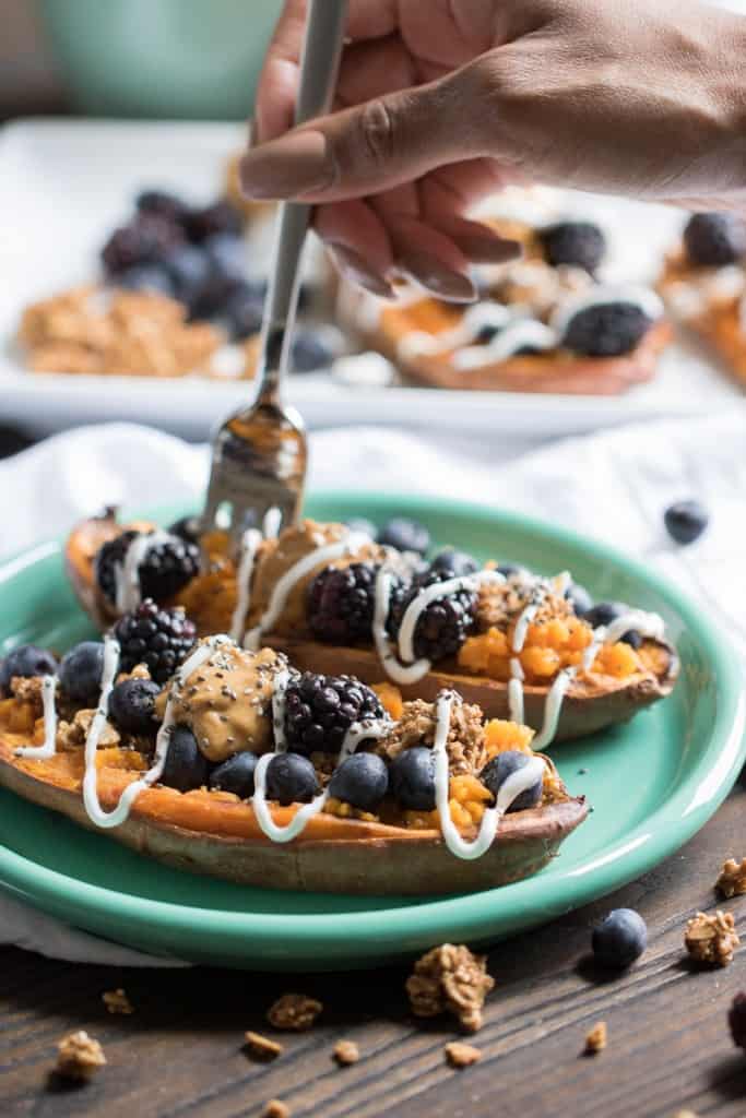 Sweet Potato Berry Breakfast Boats on a blue plate.