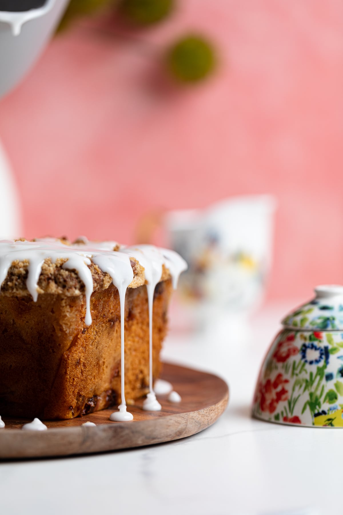 Breakfast Lemon Raspberry Coffee Cake dipping with glaze.