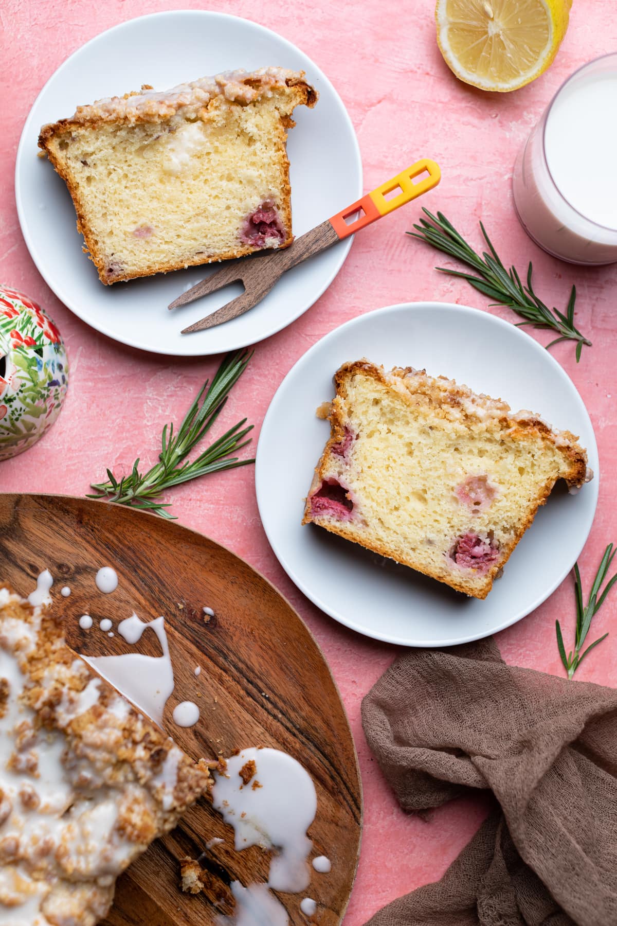 Slices of Breakfast Lemon Raspberry Coffee Cake on white plates.