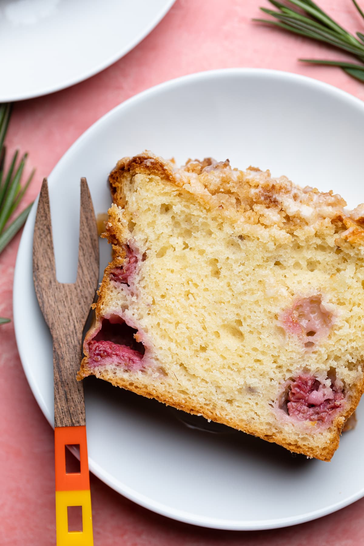 Slice of Breakfast Lemon Raspberry Coffee Cake on a white plate.