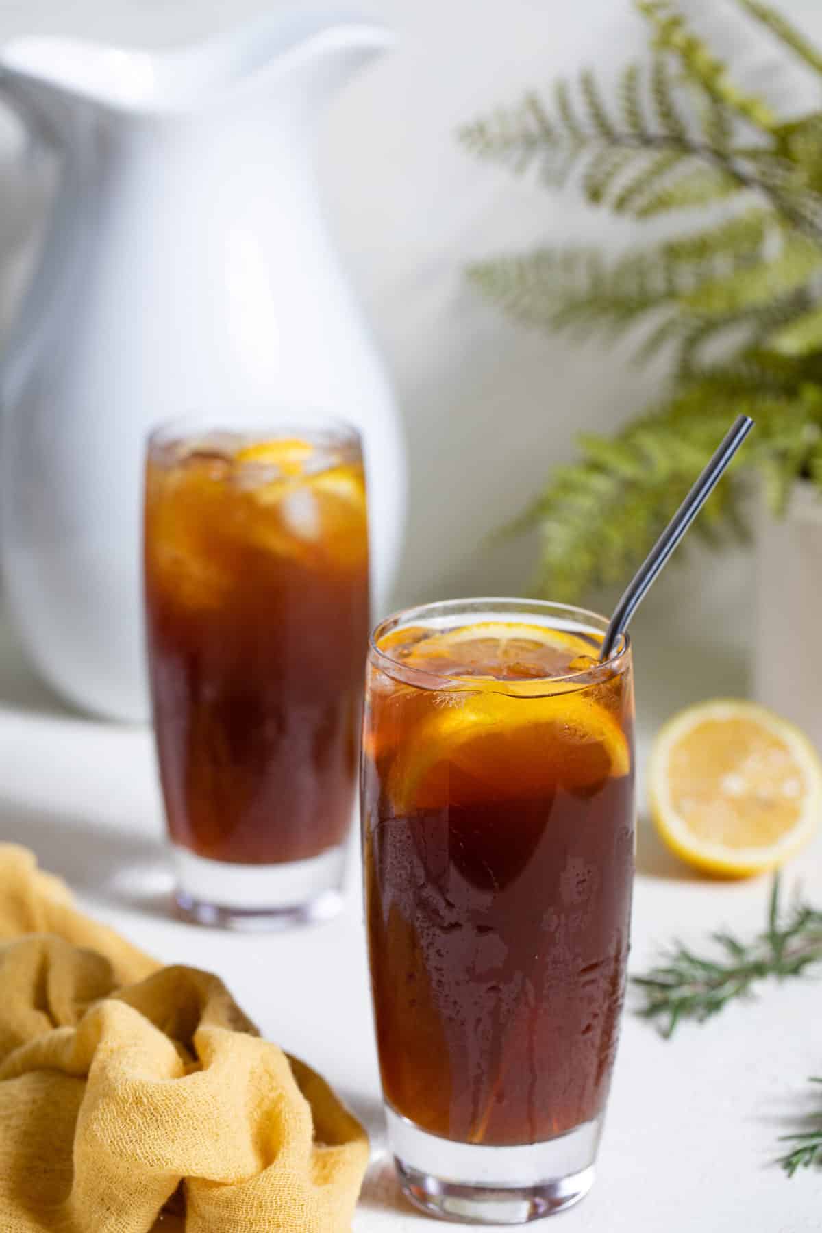 Tall glass of Traditional Southern Iced Sweet Tea with a metal straw.