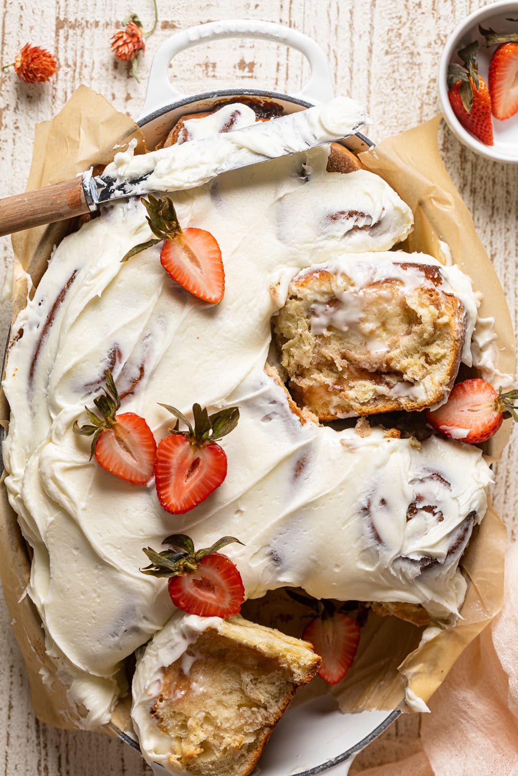 Strawberry Sweet Rolls with Lemon Cream Cheese Glaze in a Dutch oven