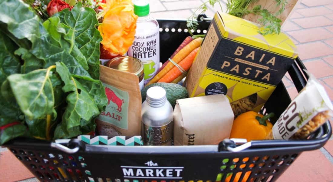 Full grocery basket including coconut water, salt, and Baia pasta.