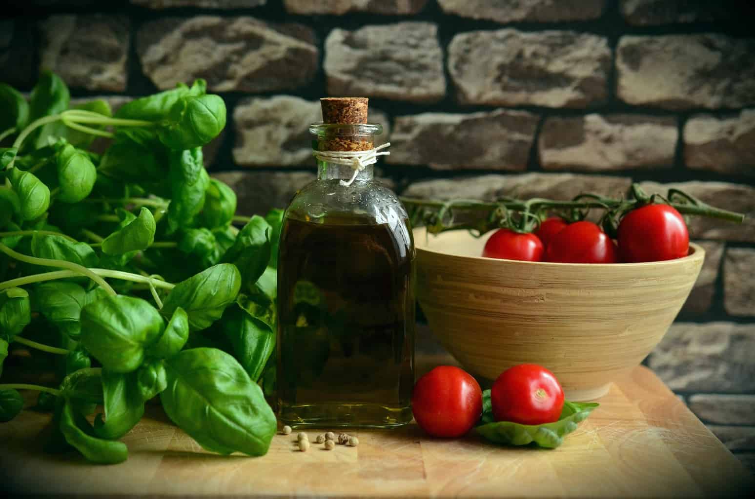 Jar of oil with tomatoes and basil.