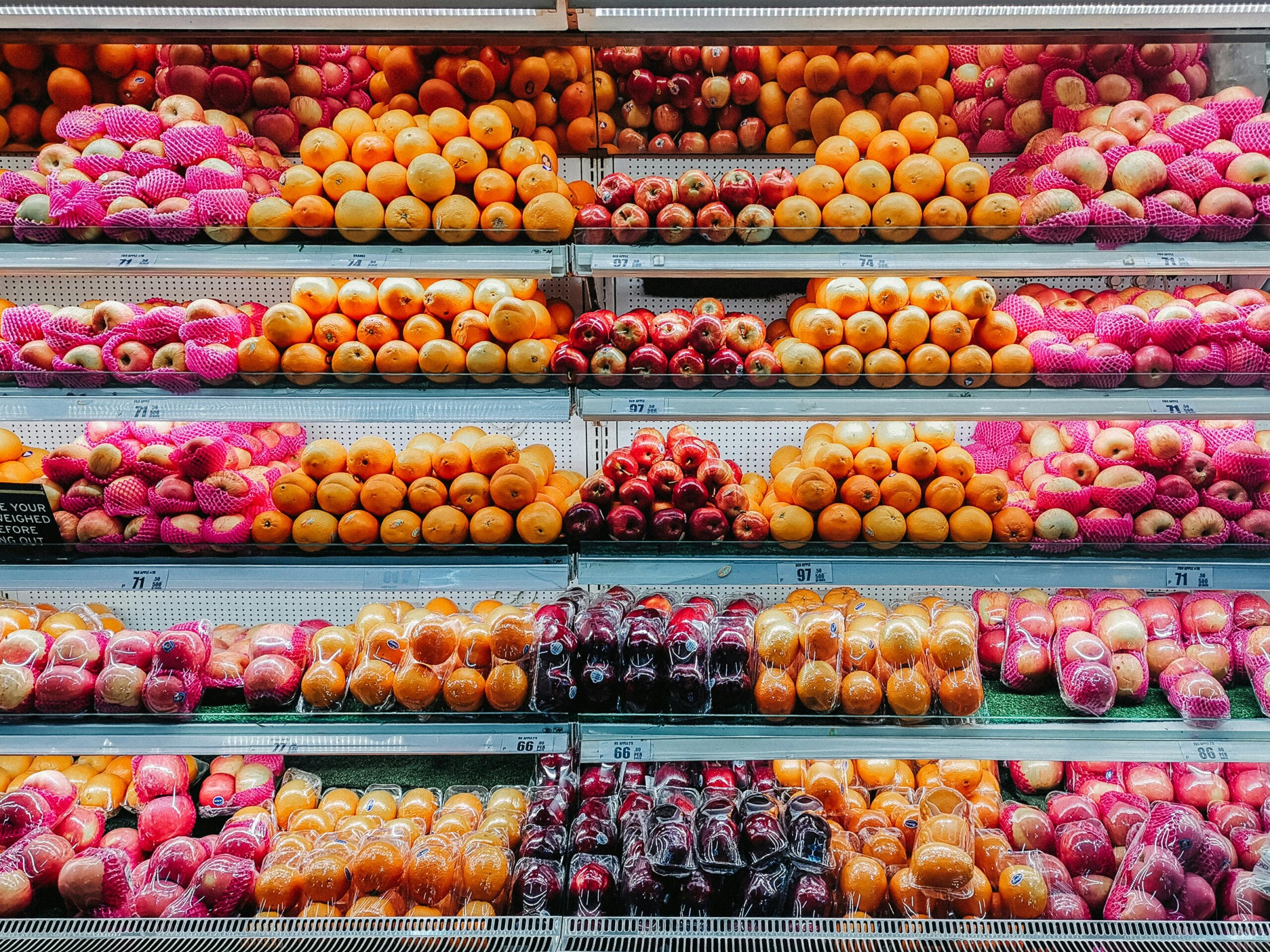 Images of a fruit aisle in the grocery store.