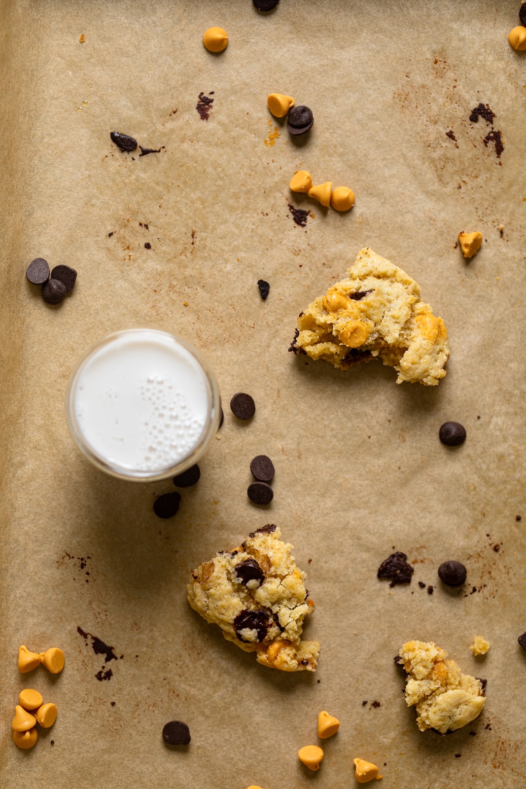 Pieces of Crinkled Chocolate Chip Butterscotch Cookies on parchment paper